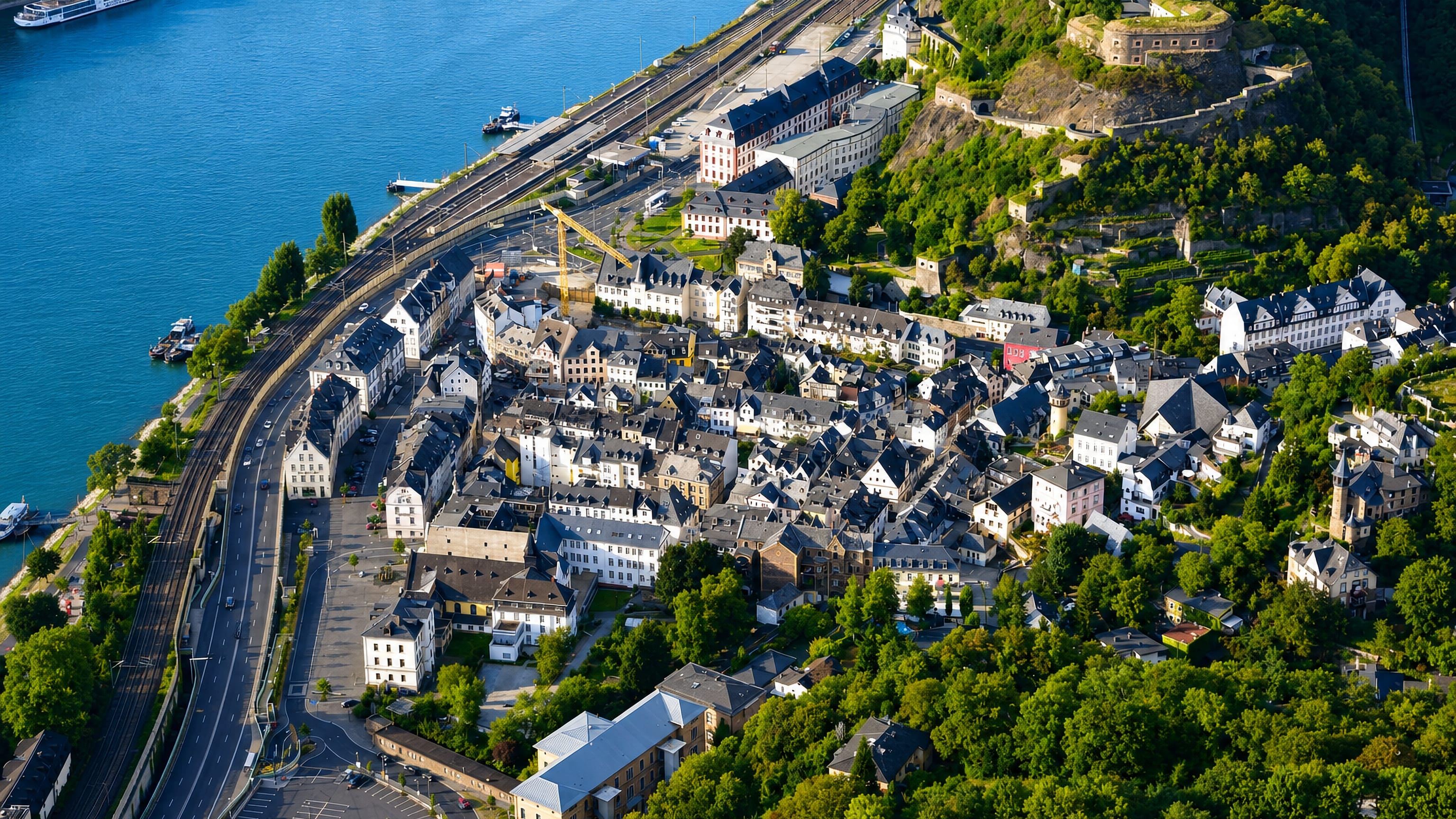 Ehrenbreitstein's riverside old town on the Rhine below its hilltop fortress, Koblenz.