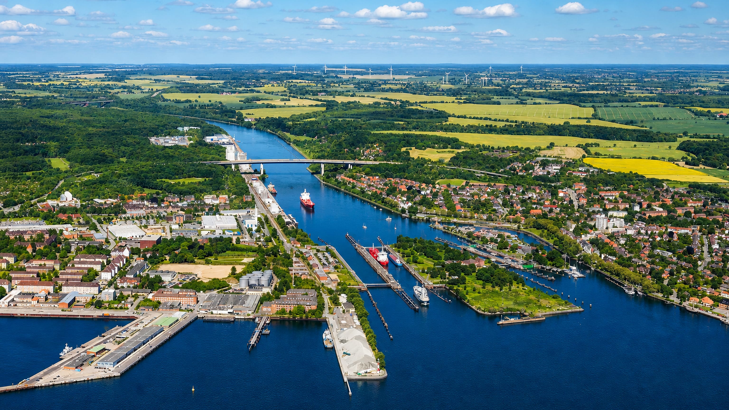 Aerial view of the Kiel Canal locks and high bridge at Holtenau where the waterway meets the Kiel Fjord.