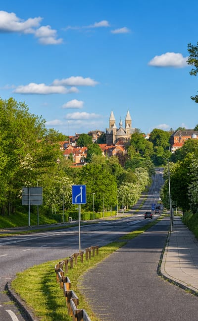 Approach road toward Viborg with the twin towers of Viborg Cathedral rising over the town in Denmark.
