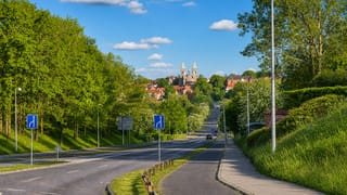 Approach road toward Viborg with the twin towers of Viborg Cathedral rising over the town in Denmark.
