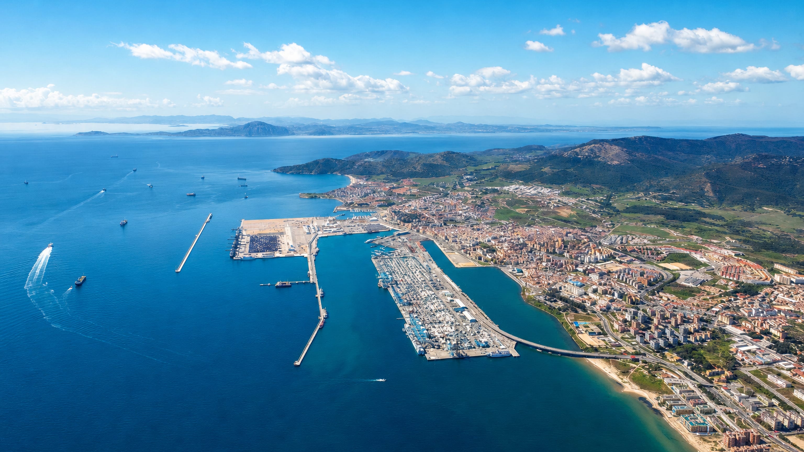 Aerial view of Algeciras, its container port and beachfront stretching along the bay in southern Spain