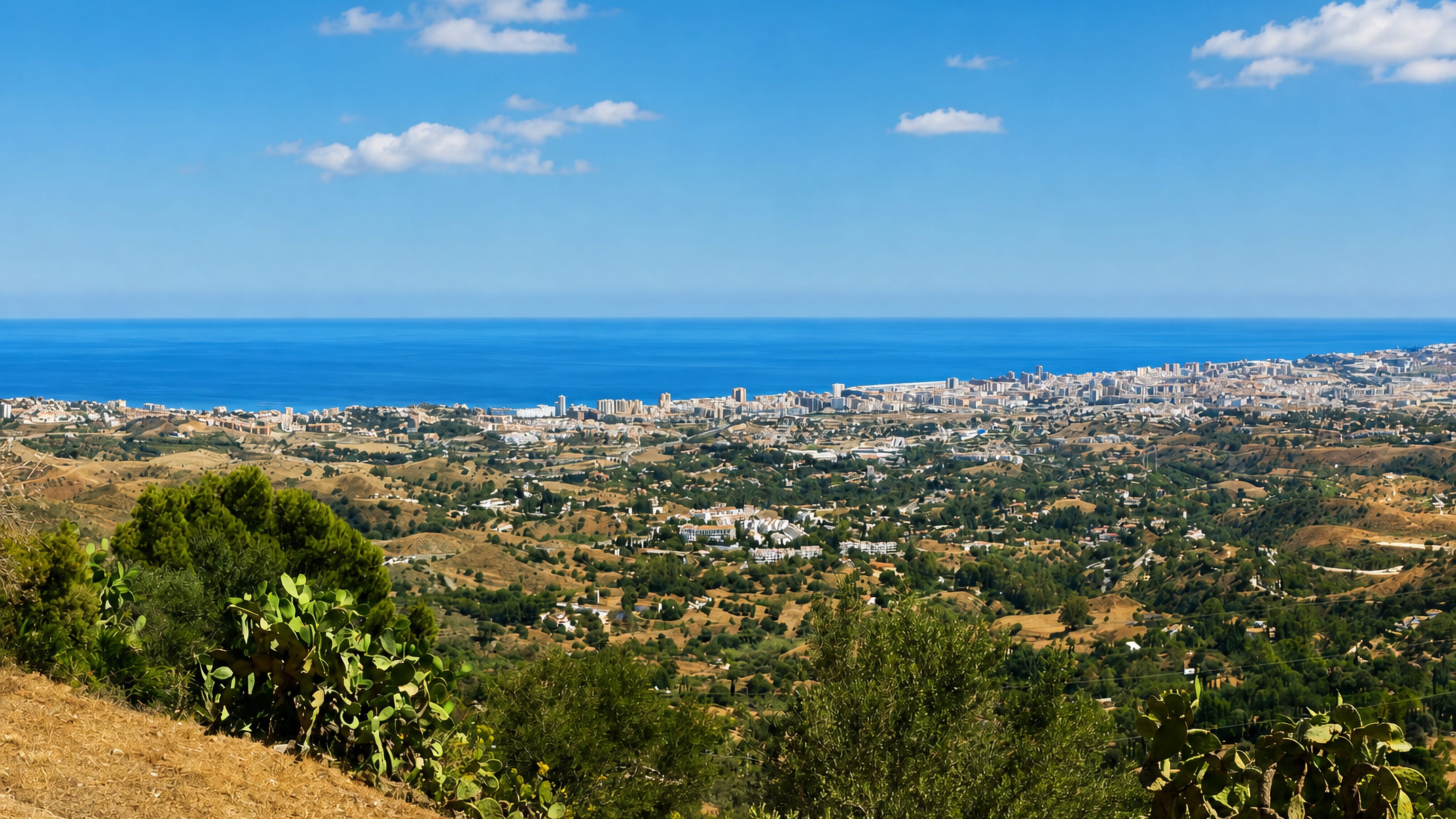 Costa del Sol coast and rolling hills seen from the heights above Mijas, Andalusia.