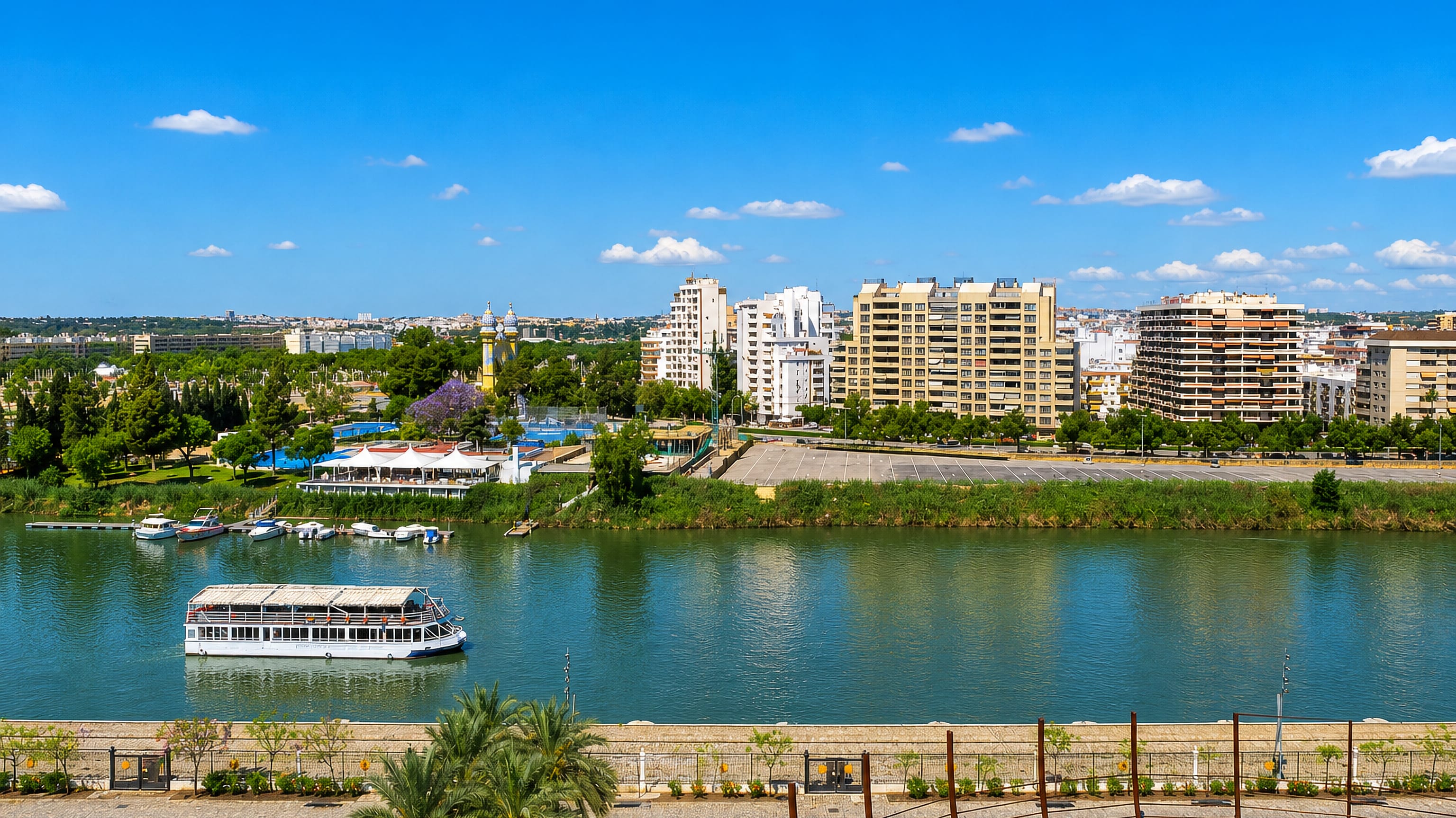 Apartment blocks of Los Remedios rising above the Guadalquivir riverbank in Seville.