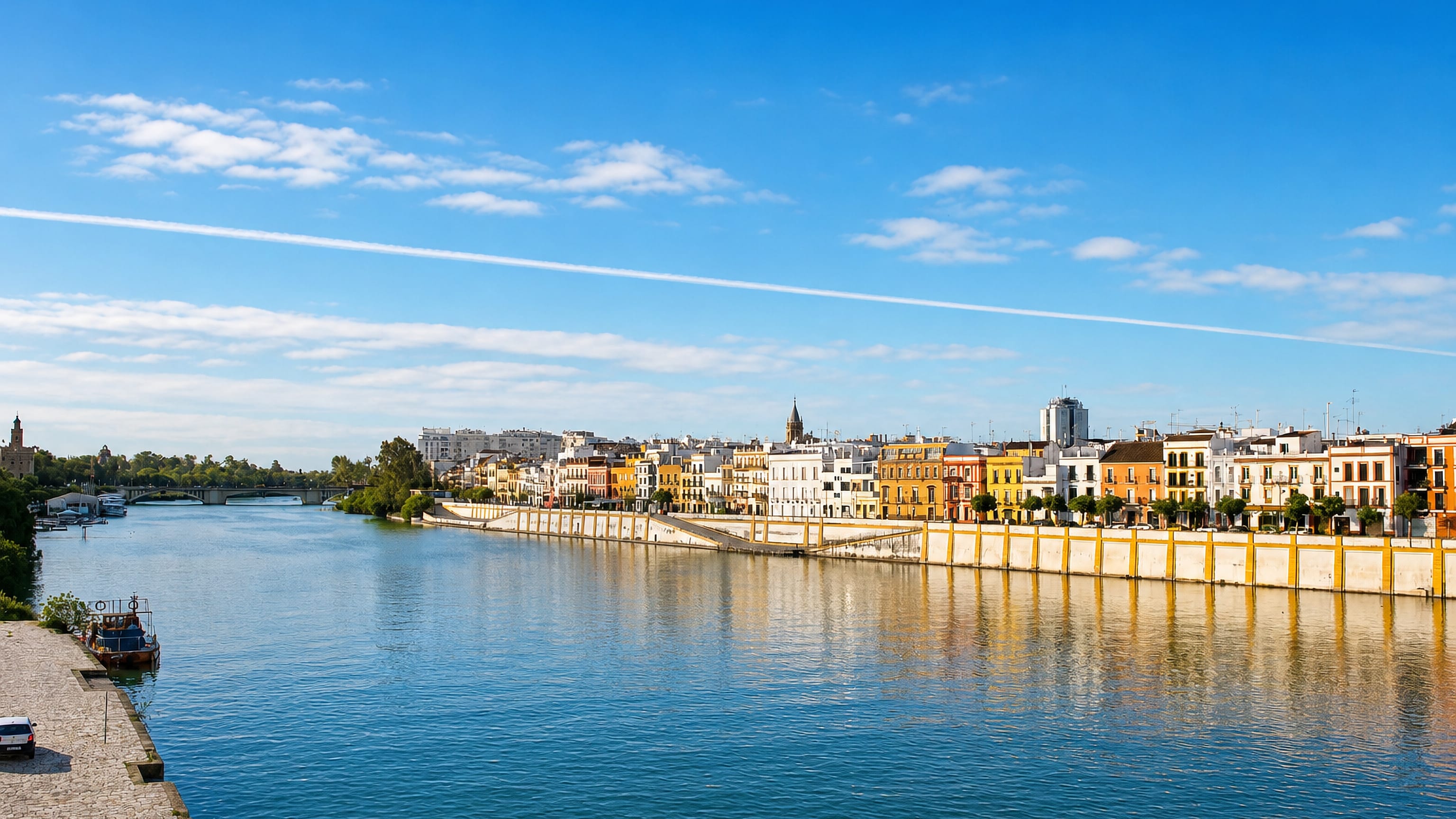 Colourful houses lining the Guadalquivir riverfront of the Triana district in Seville, Spain.