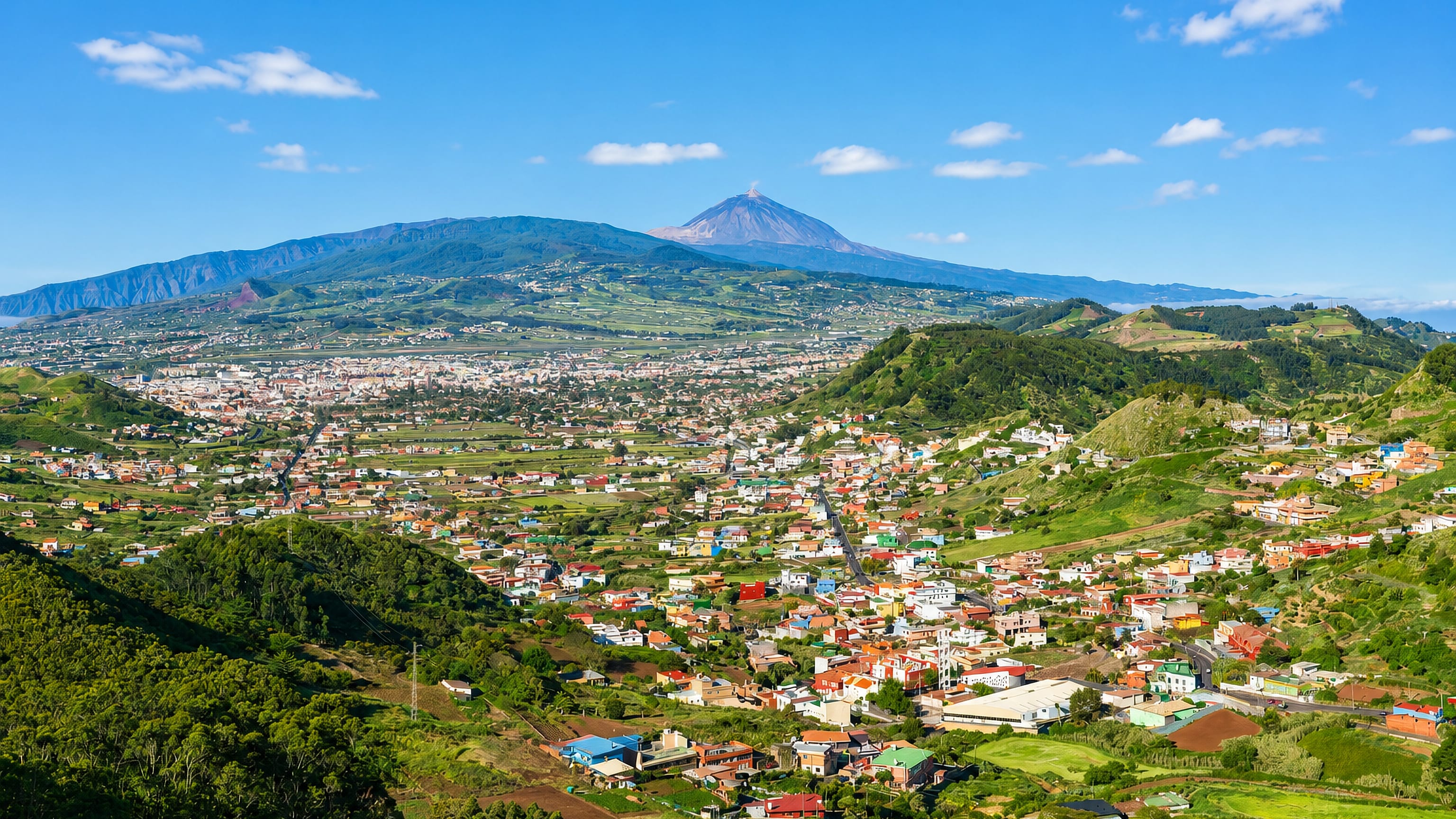 San Cristobal de La Laguna spreading across its Tenerife valley, with Mount Teide rising behind the town.