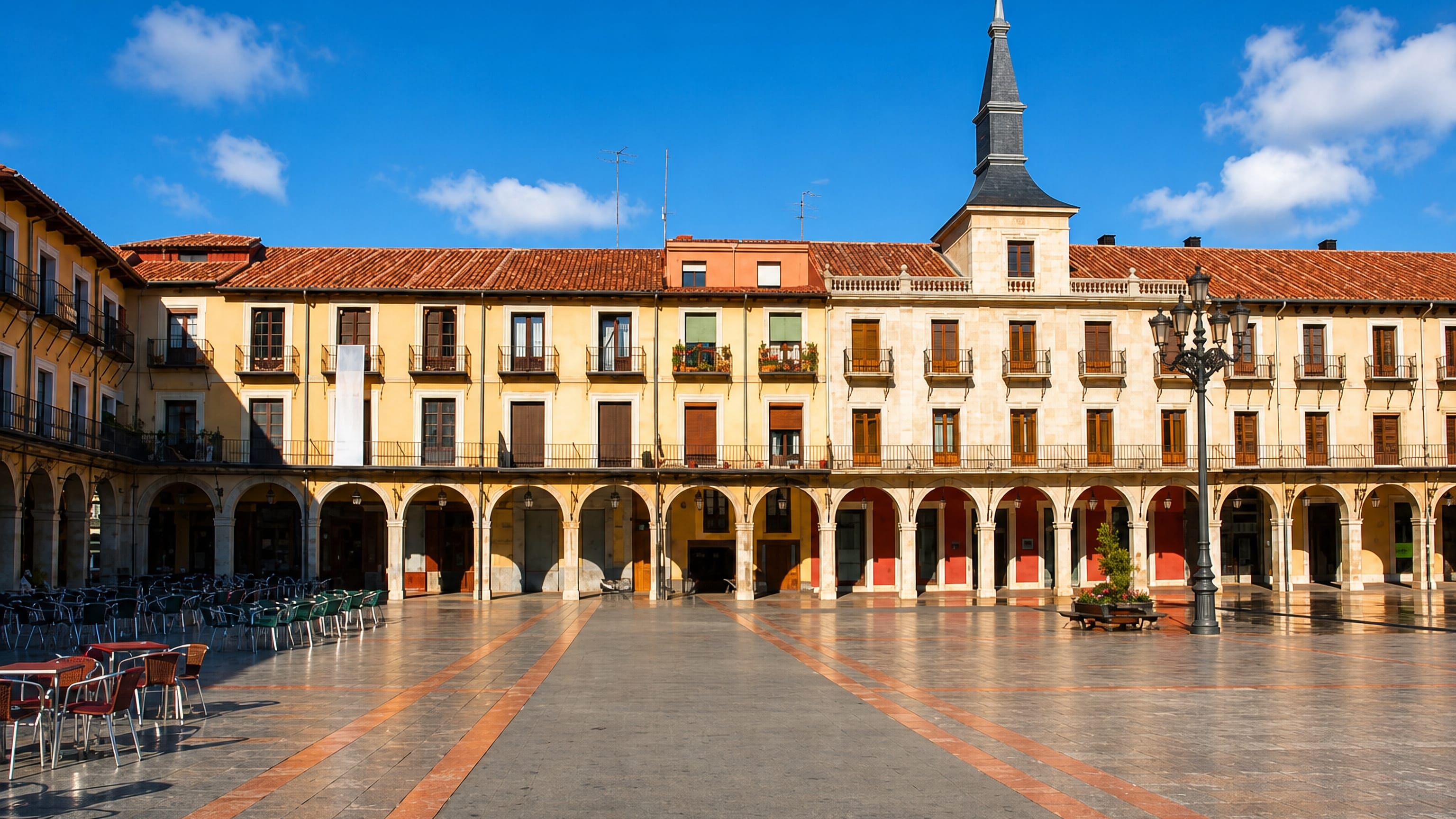 León's arcaded Plaza Mayor, its slate-spired town hall and balconied facades ringing the empty stone square.