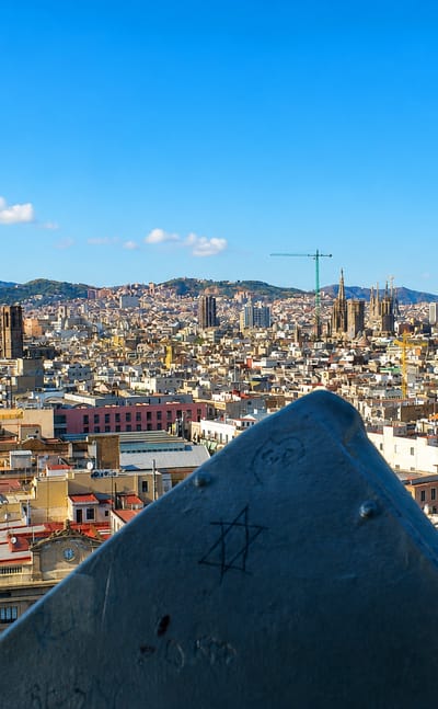 Elevated view over central Barcelona from El Raval with La Rambla and the Sagrada Familia on the skyline