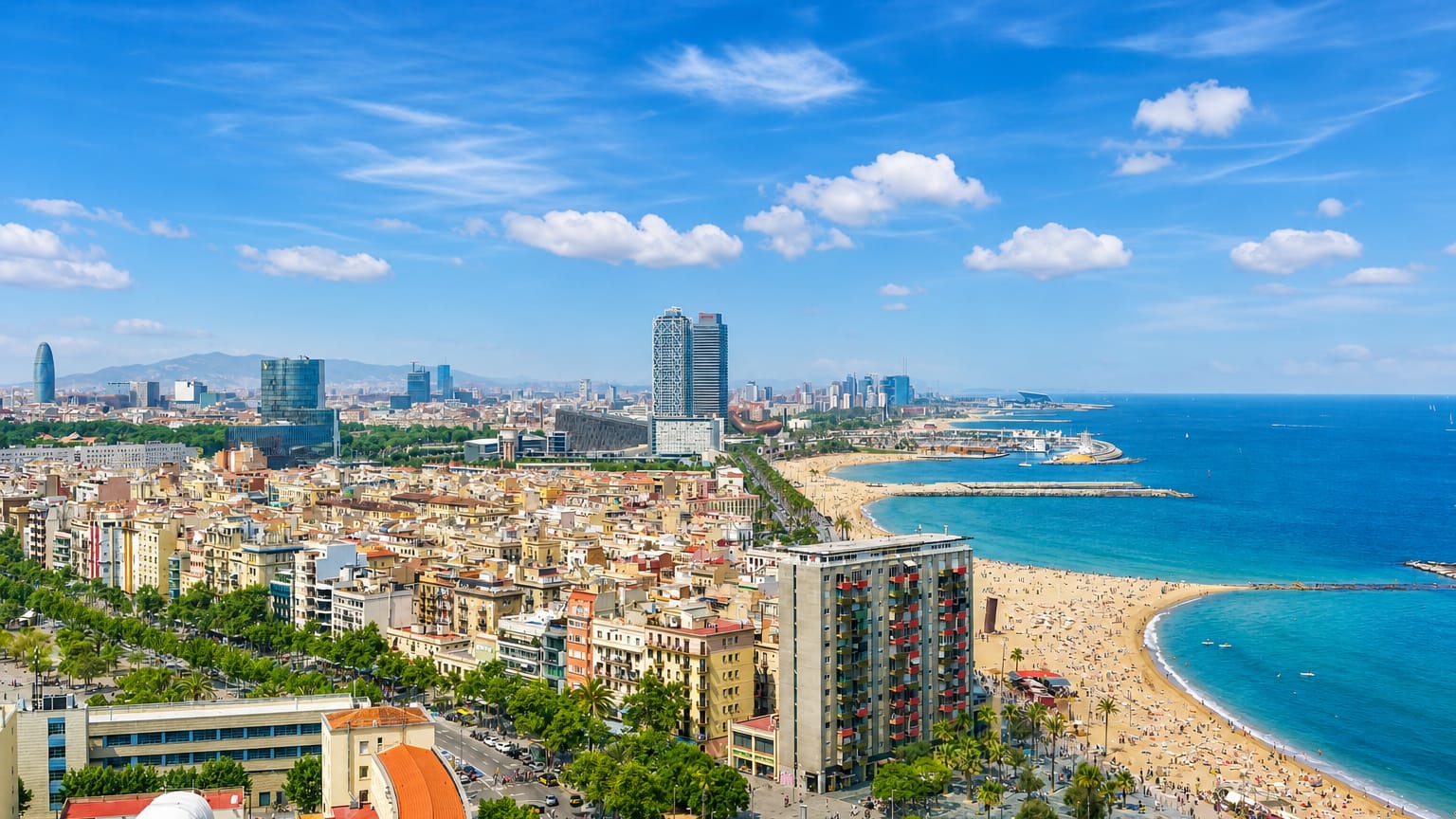 Barcelona seafront with Port Olimpic towers and a busy beach, standing in for the Sants district