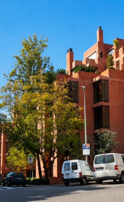 Leafy street of distinctive terracotta modernist apartment blocks below the Collserola hills in Barcelona's Sarria-Sant Gervasi