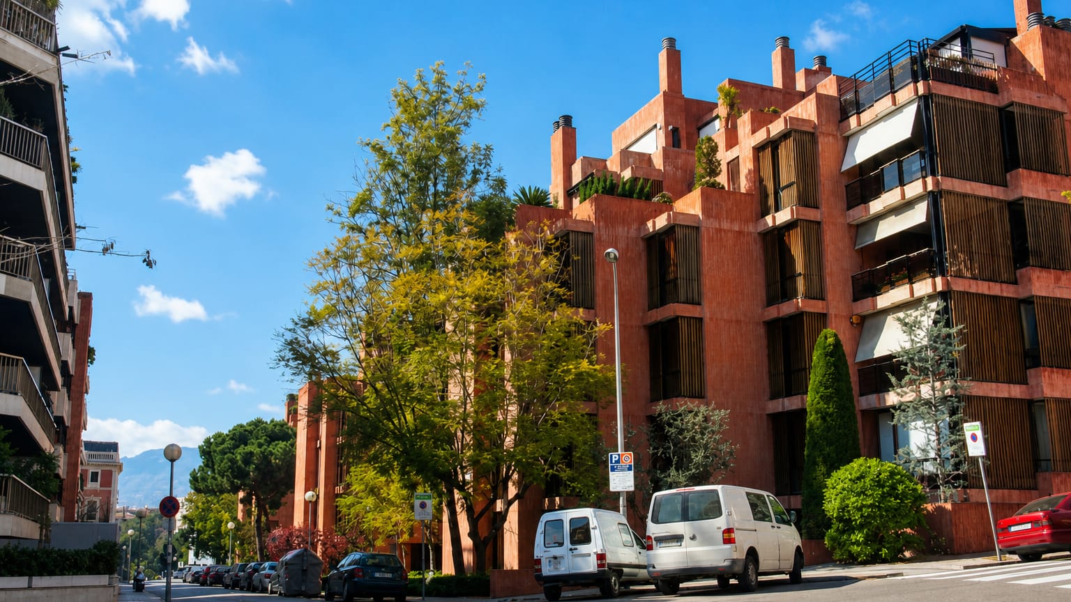 Leafy street of distinctive terracotta modernist apartment blocks below the Collserola hills in Barcelona's Sarria-Sant Gervasi