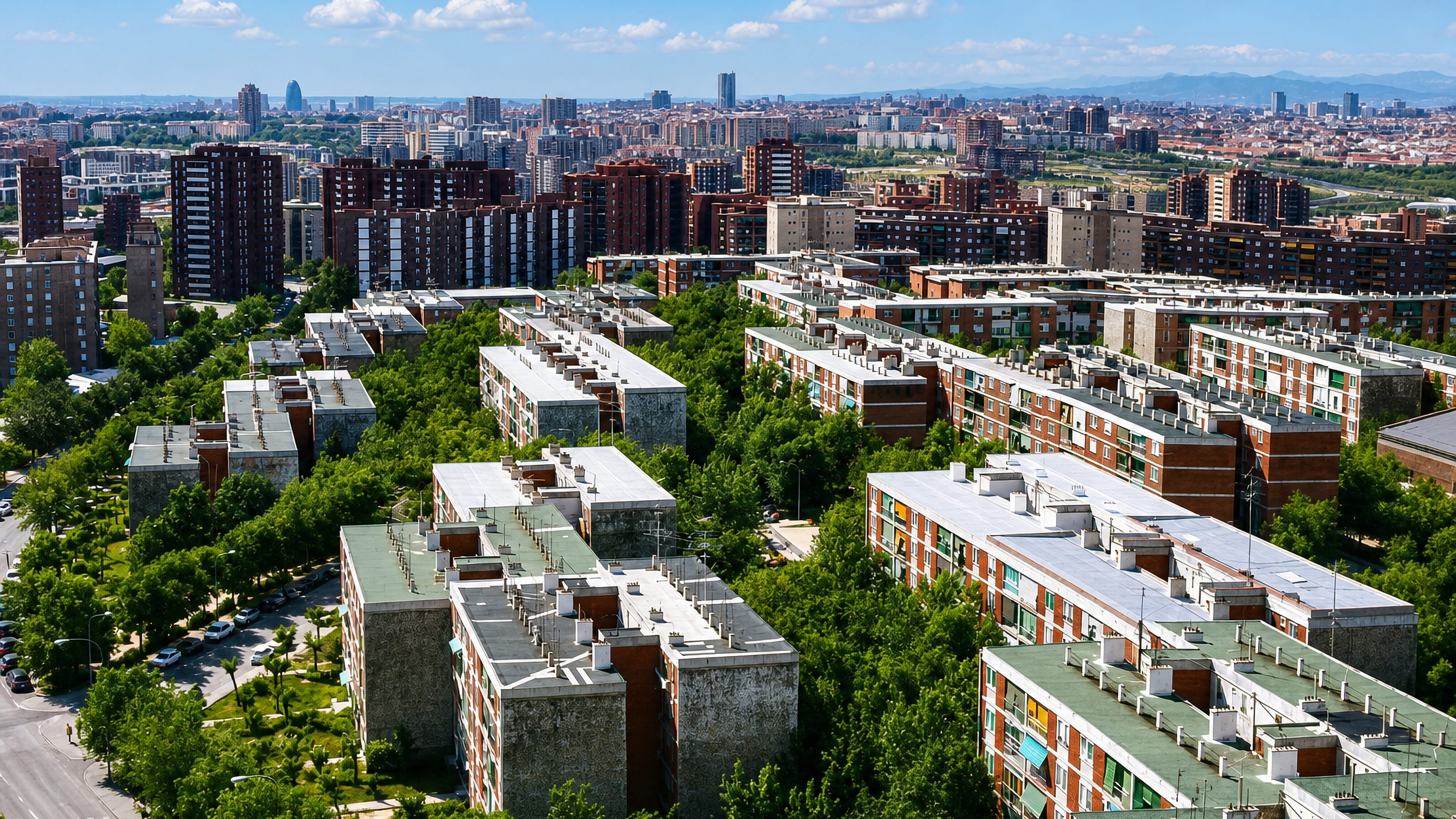 Aerial view of Fontarrón's residential apartment blocks and trees with Madrid's skyline towers on the horizon