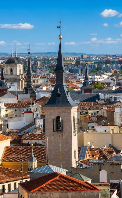 Rooftop skyline of central Madrid showing domes, spires and church towers across Madrid Centro.