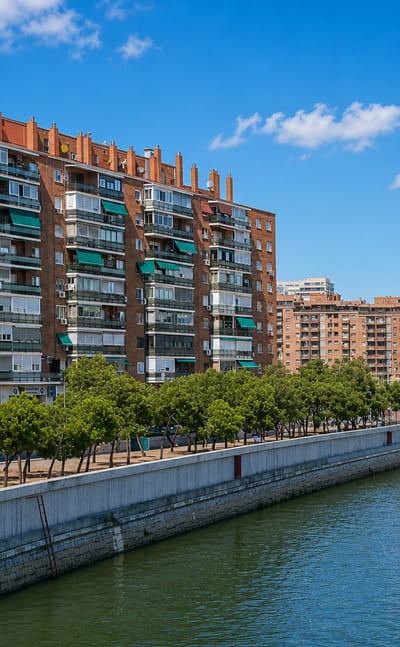 Brick riverside apartment blocks along the Manzanares embankment in Madrid's Moscardó neighbourhood