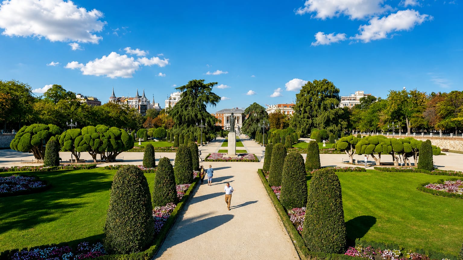 Formal gardens, clipped hedges and tree-lined paths of El Retiro Park in the Retiro district of Madrid.
