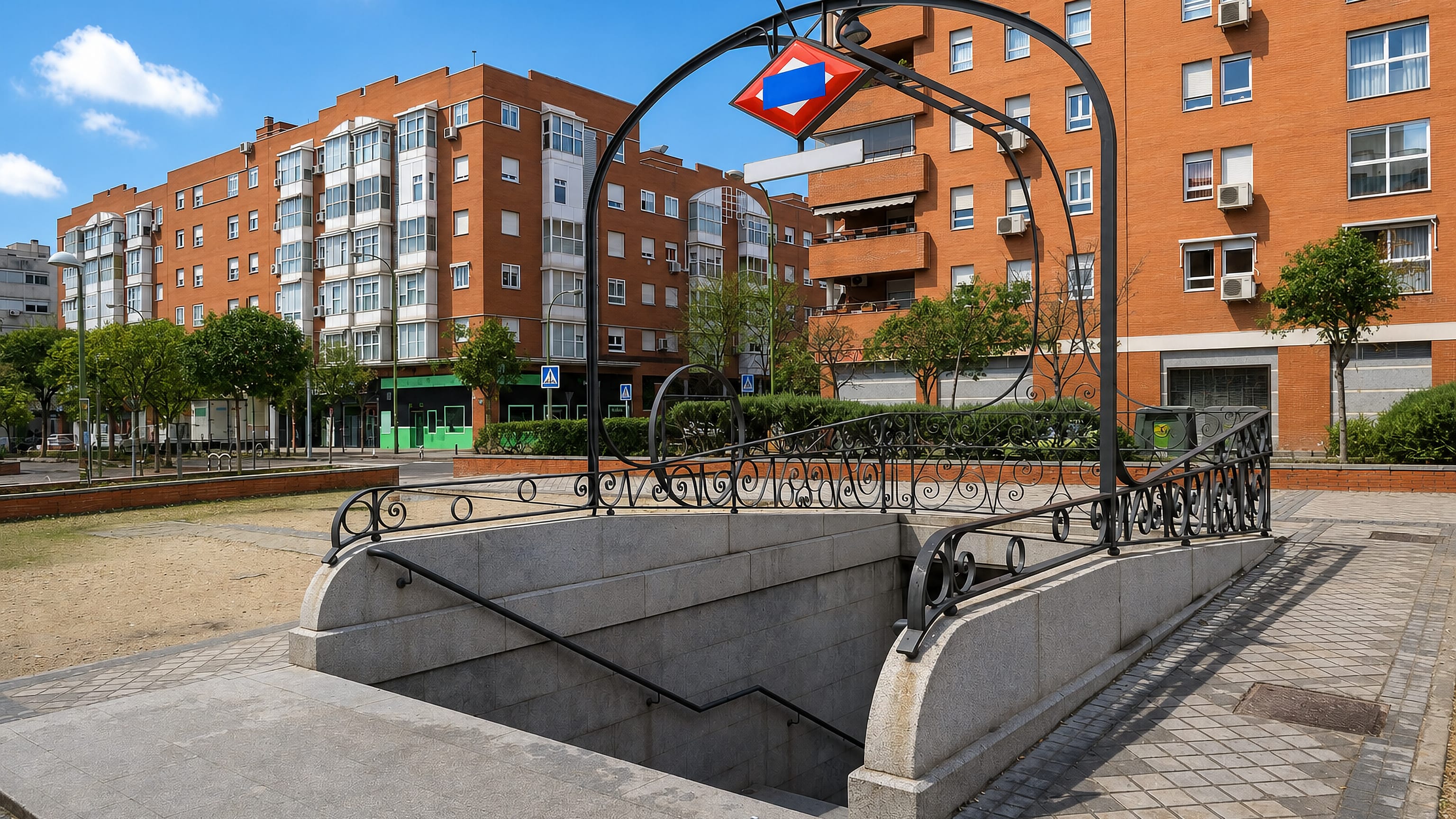 Metro entrance and red-brick apartment blocks in Valdebernardo, eastern Madrid