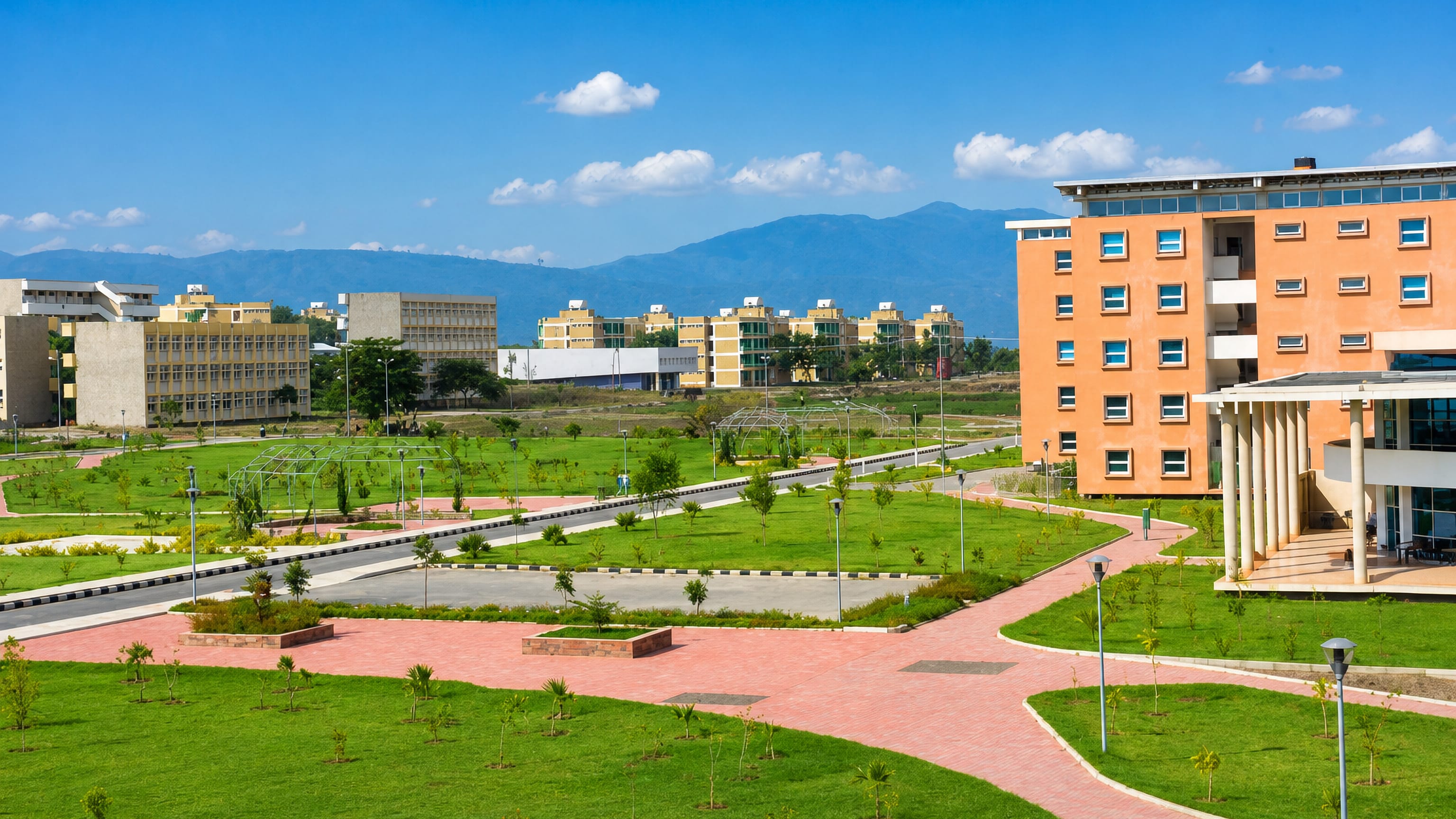 Landscaped campus lawns and pastel apartment blocks below highland ridges in Awasa, Sidama.