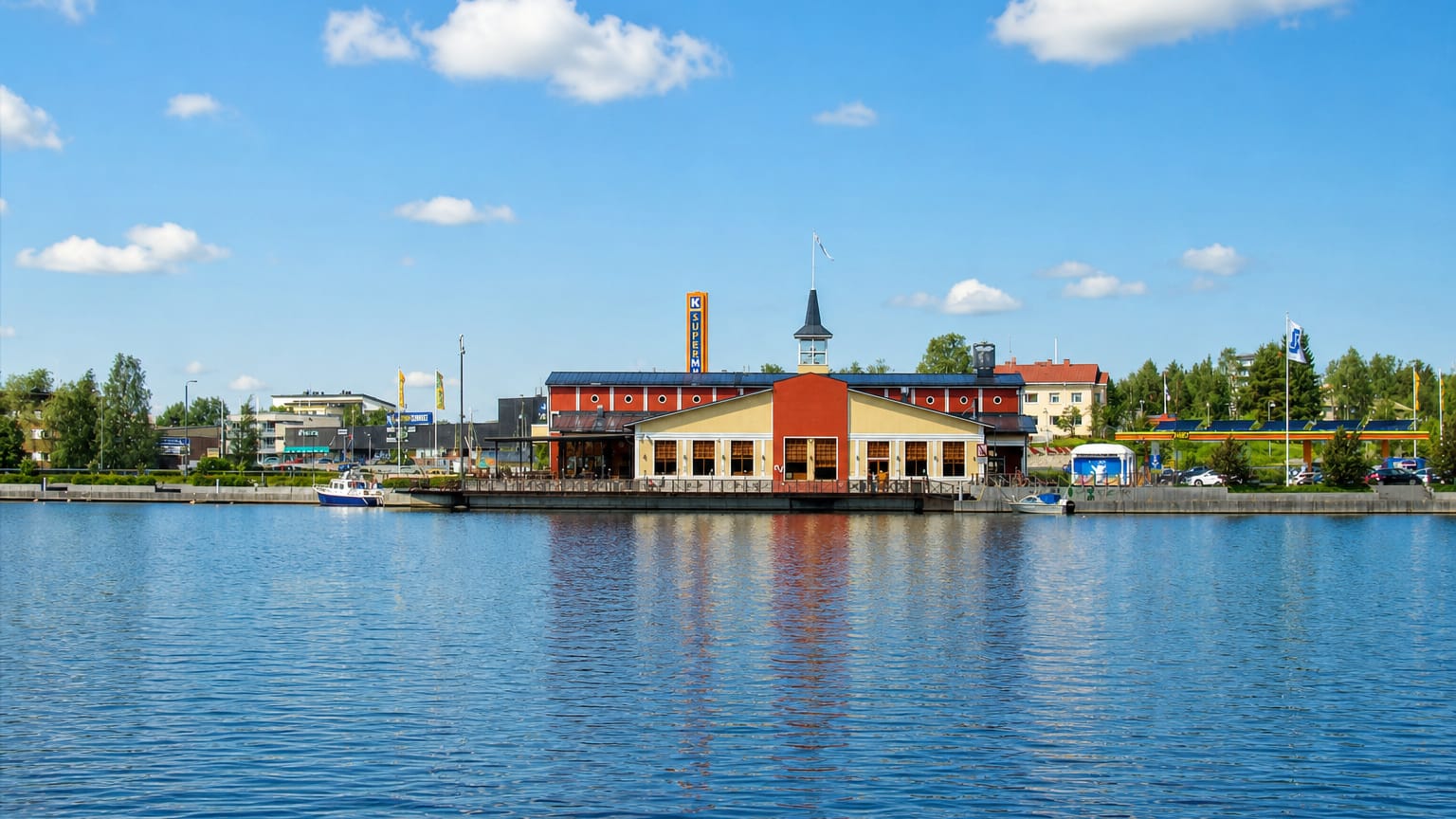 A red waterfront market building reflected in the lake at Viitasaari, central Finland.