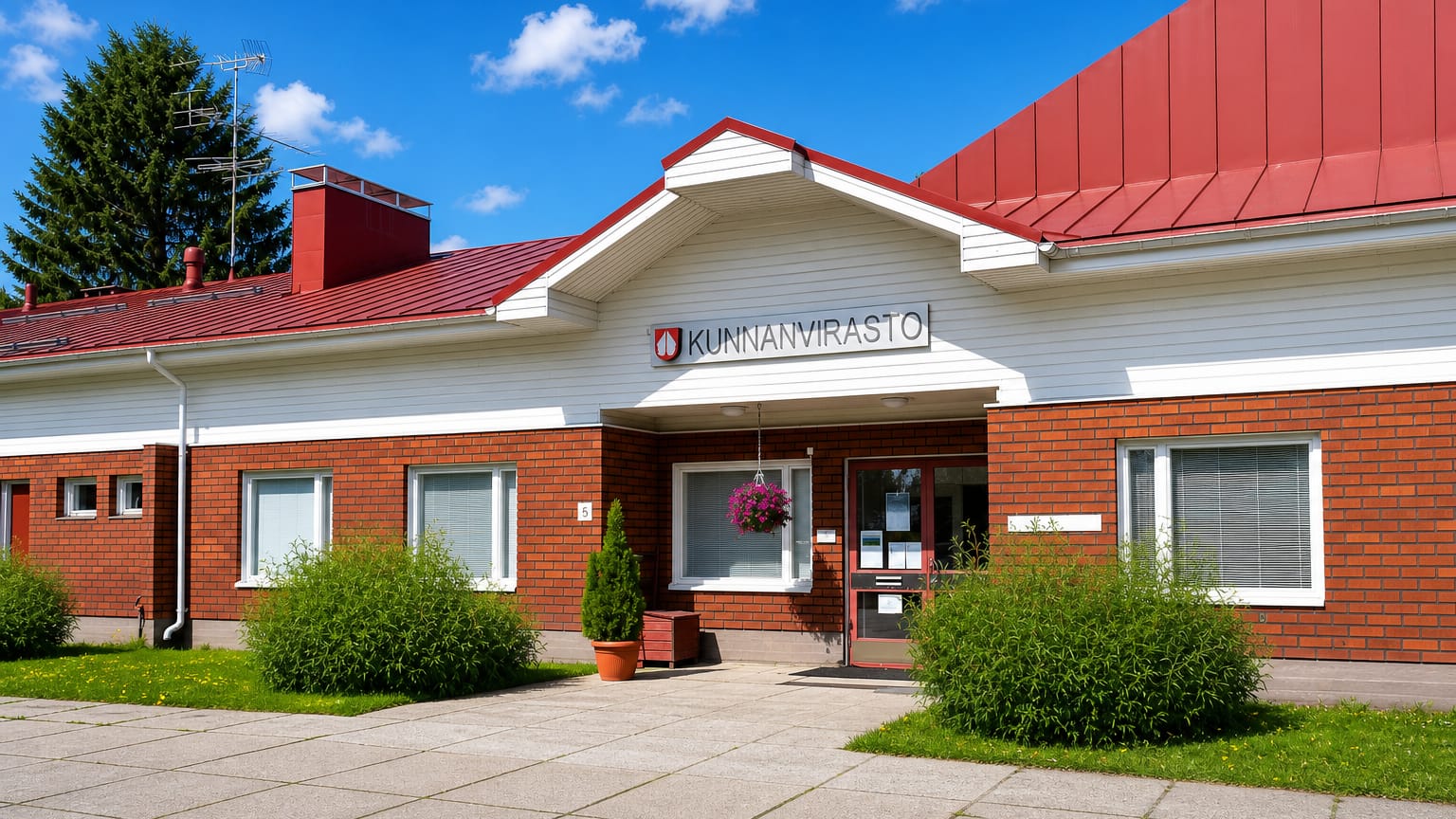 The brick municipal office (kunnanvirasto) of Halsua in Central Ostrobothnia under a clear summer sky.