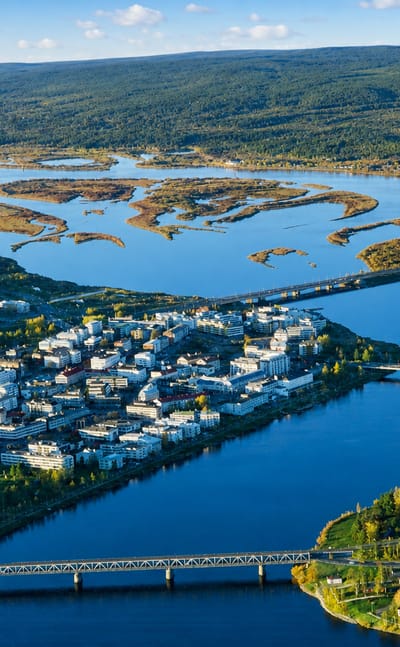 Aerial view of Rovaniemi, Finland, at its river confluence with the cable-stayed Jätkänkynttilä Bridge