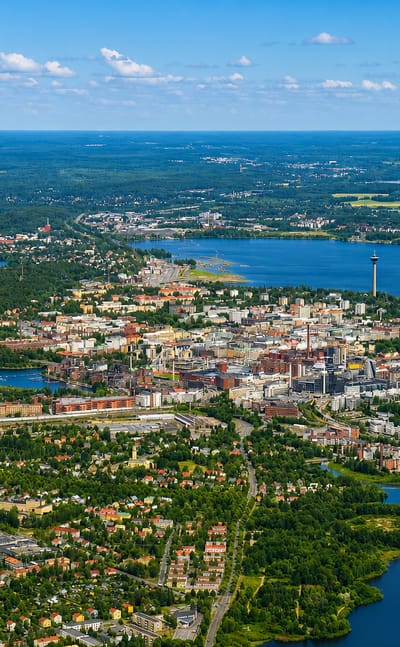Aerial view of Tampere and the Kalevanharju district between lakes, with the Näsinneula tower on the skyline