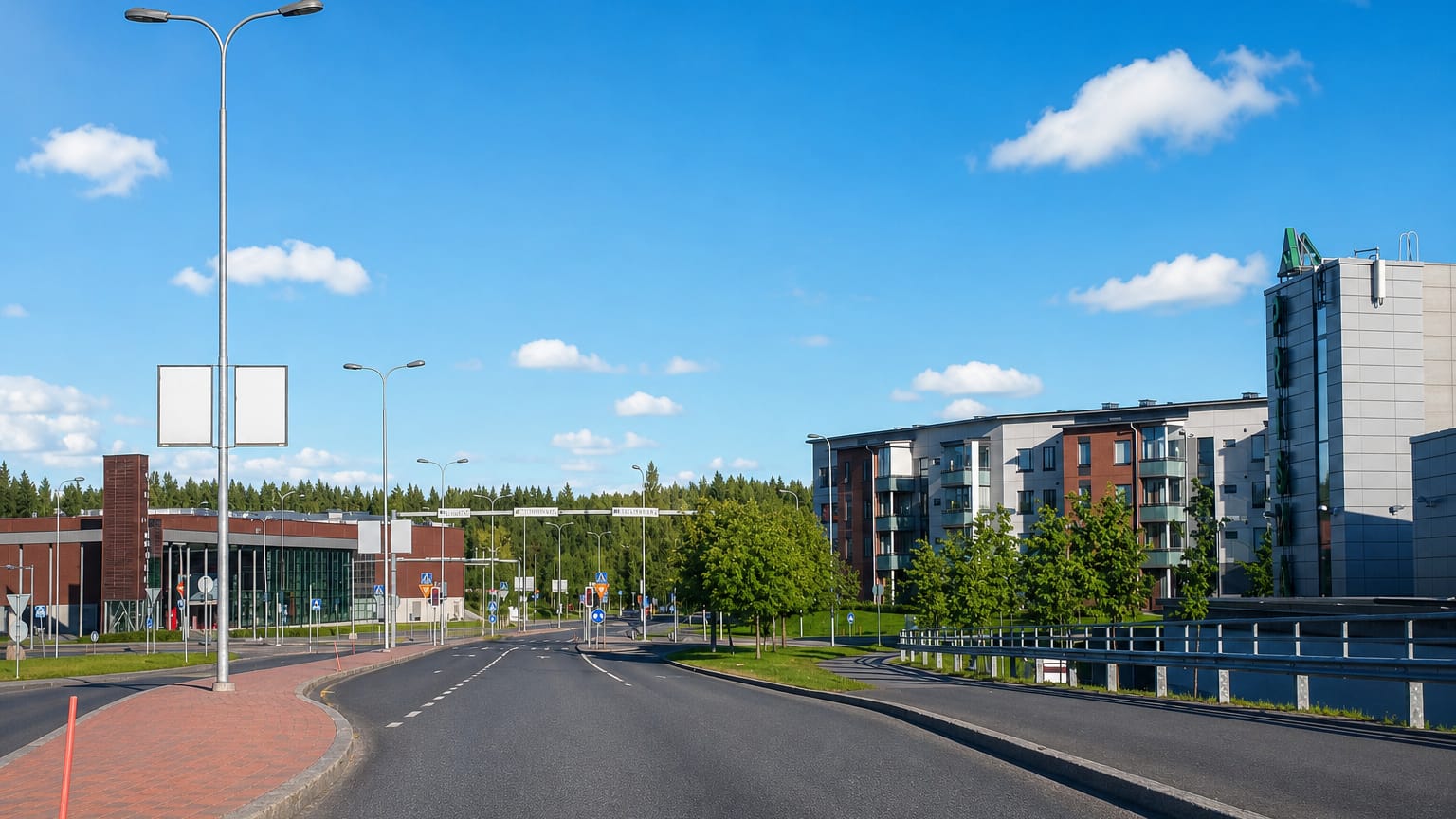 Wide road past a brick shopping centre and modern apartment blocks in Linnainmaa, Tampere.