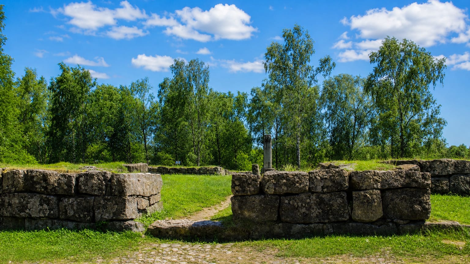 Stone ruins and cobbled paths among birches at Vanha Vaasa, the old town site of Vaasa in Finland.