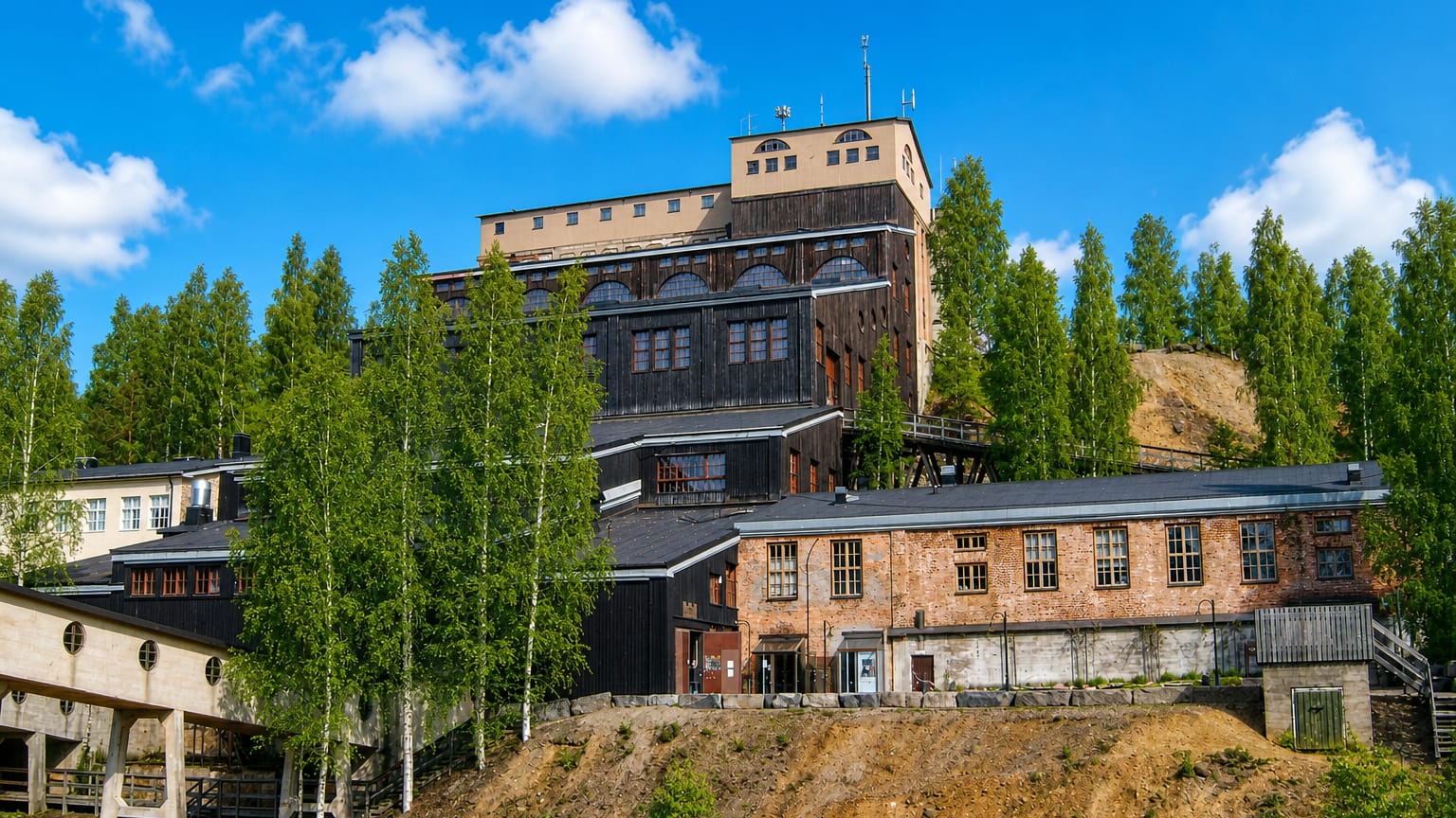 Outokumpu's Old Mine museum, its timber headframe and red-brick works rising on a hill among birches