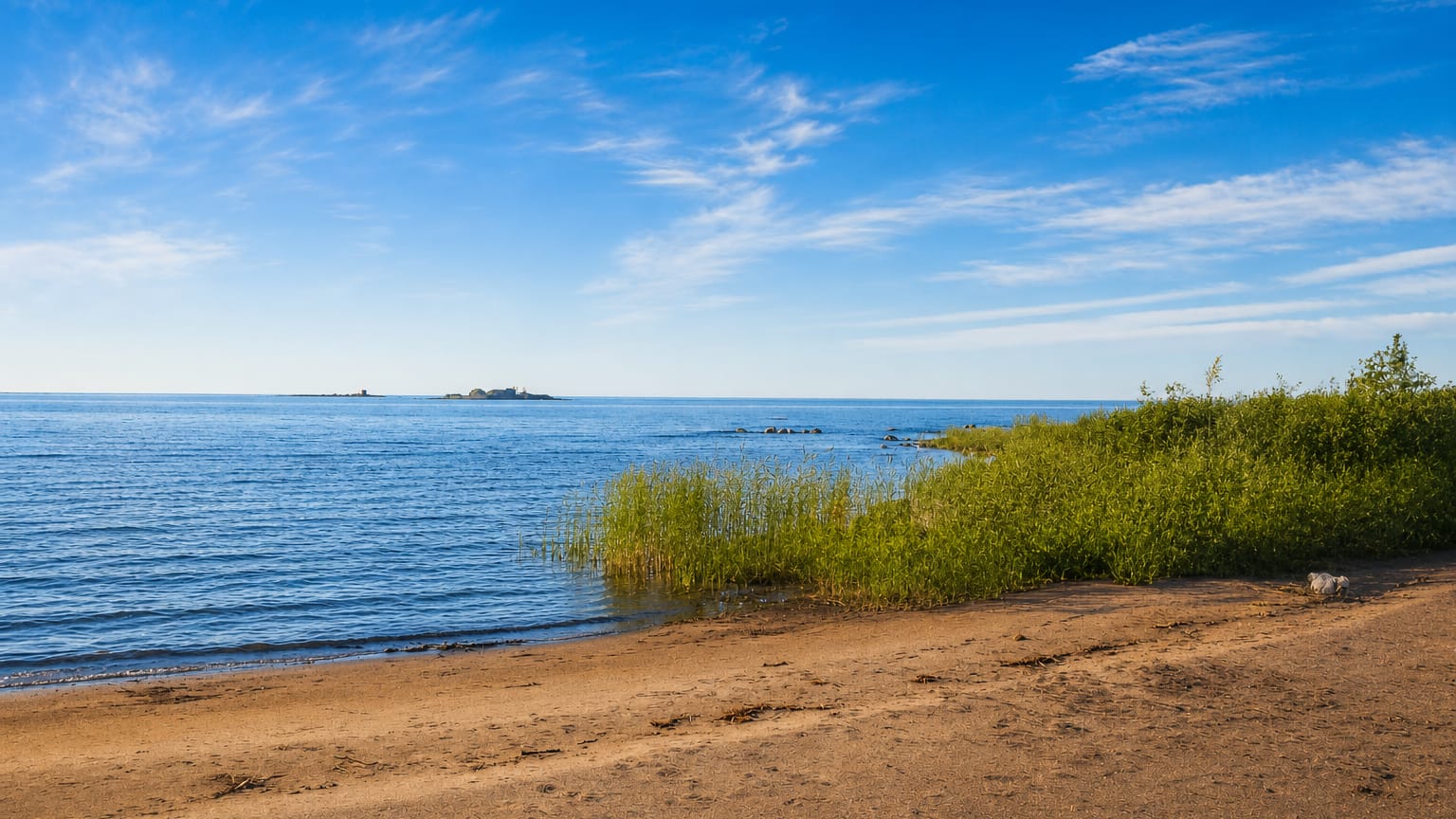 Wide sandy beach at Kalajoki, Finland, meeting the calm blue Gulf of Bothnia under a bright summer sky