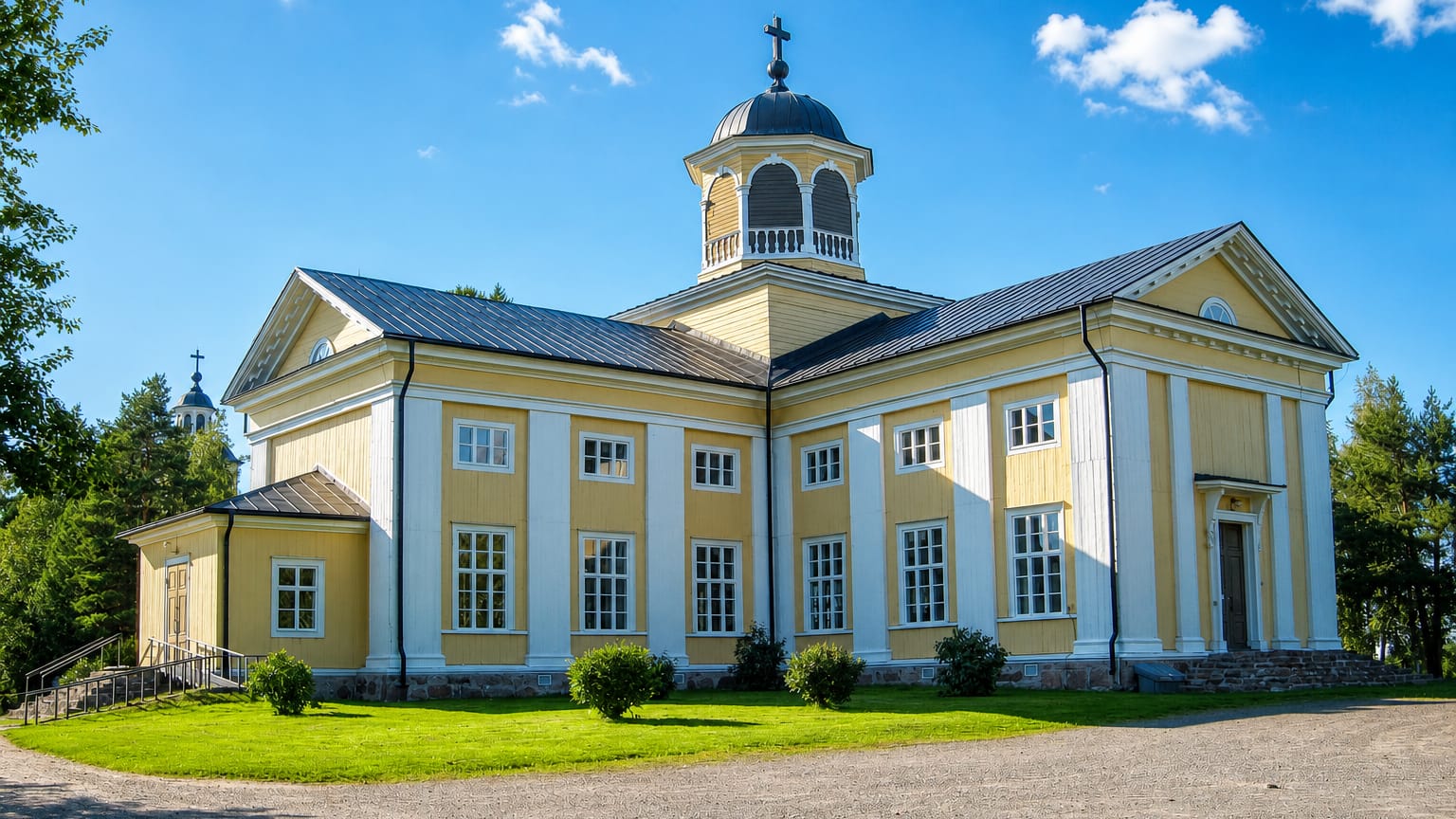 Yellow-and-white neoclassical wooden church with a cupola bell tower under a summer sky in Liminka, Finland.