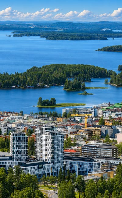 Aerial summer view over Kuopio, Finland, with its lakeside downtown and the forested islands of Lake Kallavesi beyond.