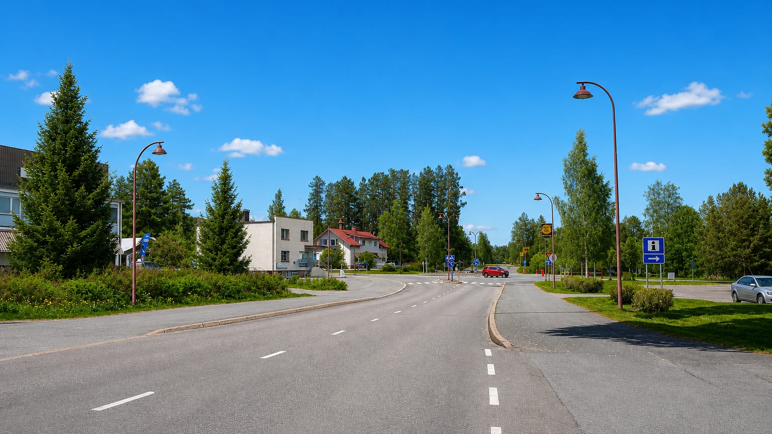 A quiet main road lined with lampposts and houses through the rural centre of Soini, South Ostrobothnia.
