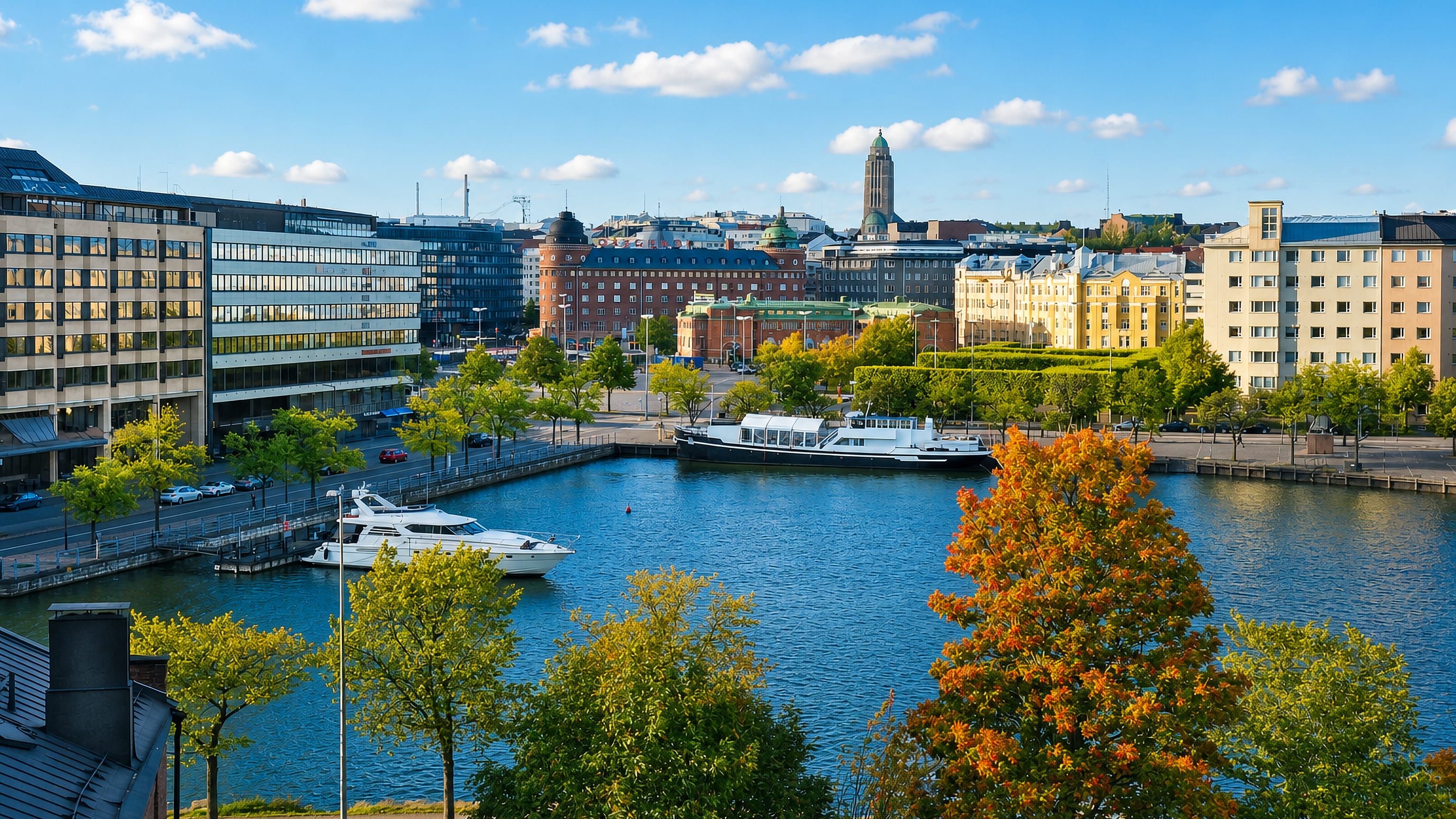 Hakaniemi's waterfront in Helsinki with moored boats and Kallio Church rising above the bay.