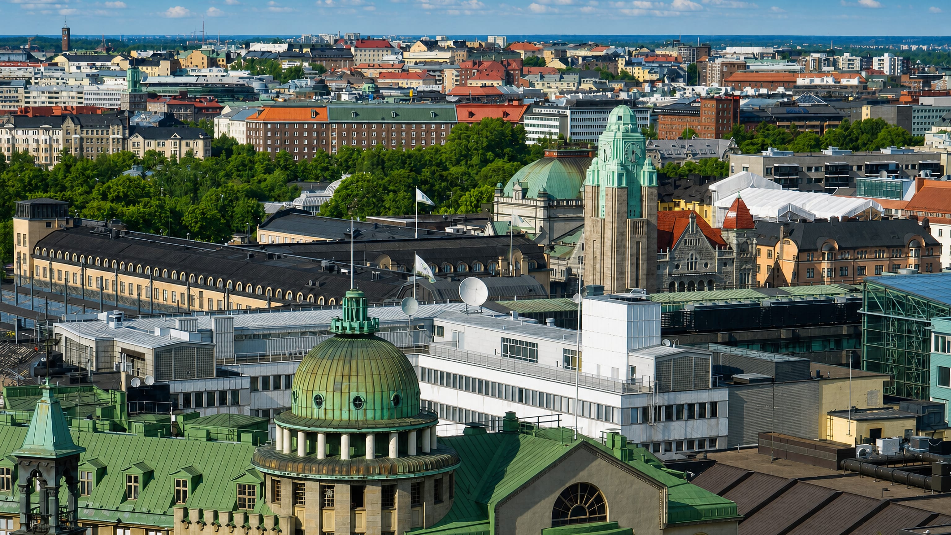 Rooftops, copper domes and the railway station tower over Kluuvi in central Helsinki.