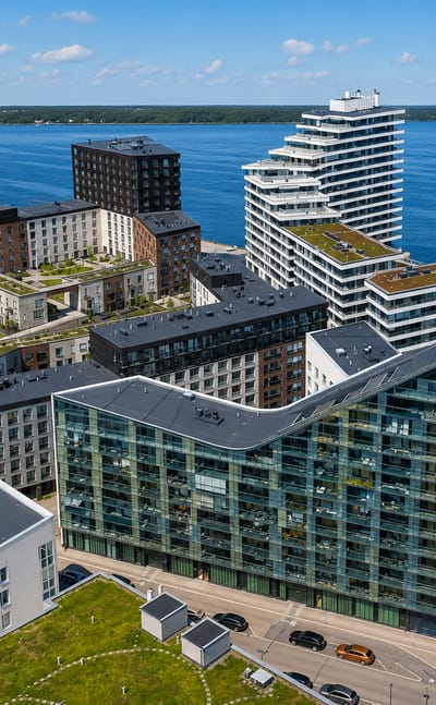 Modern glass and brick waterfront apartment blocks beside the sea in Verkkosaari, Helsinki.