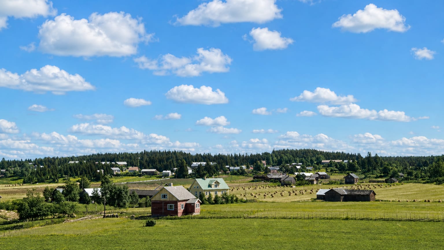 Rural Nousiainen, Finland: a red wooden farmhouse, hay bales and green fields below a conifer treeline and blue summer sky.
