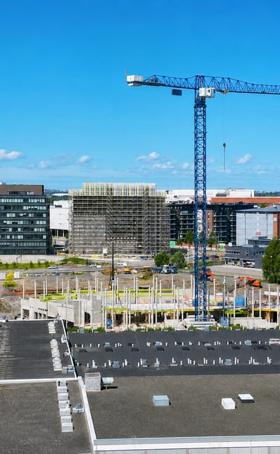 Tower crane and office blocks over the redeveloping Itäharju business district in Turku.