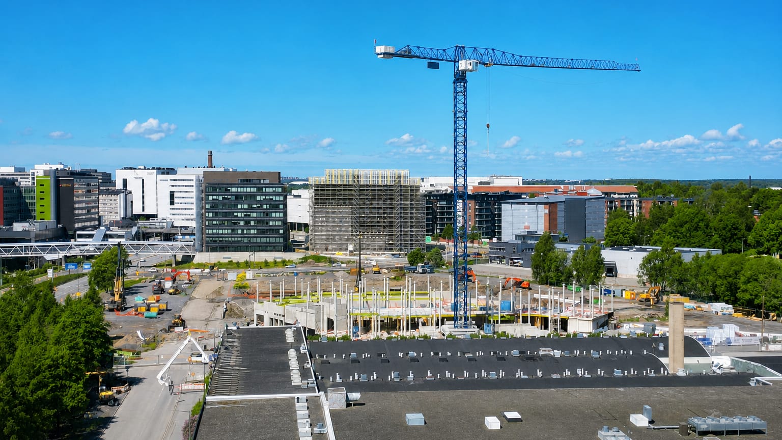 Tower crane and office blocks over the redeveloping Itäharju business district in Turku.