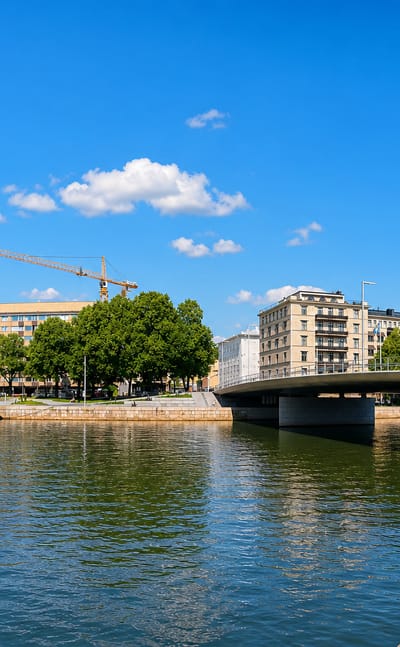 Moored ship and a road bridge on the Aura River beside the VII kaupunginosa district of Turku.