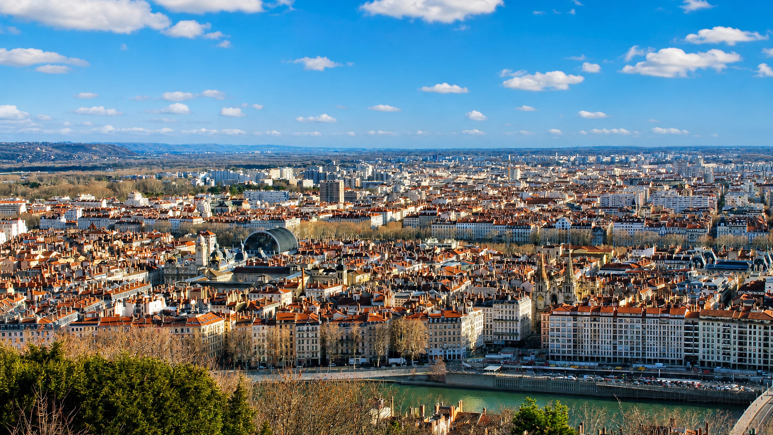 Terracotta rooftops of central Lyon and the Saône seen from Fourvière, north toward the 6th arrondissement.