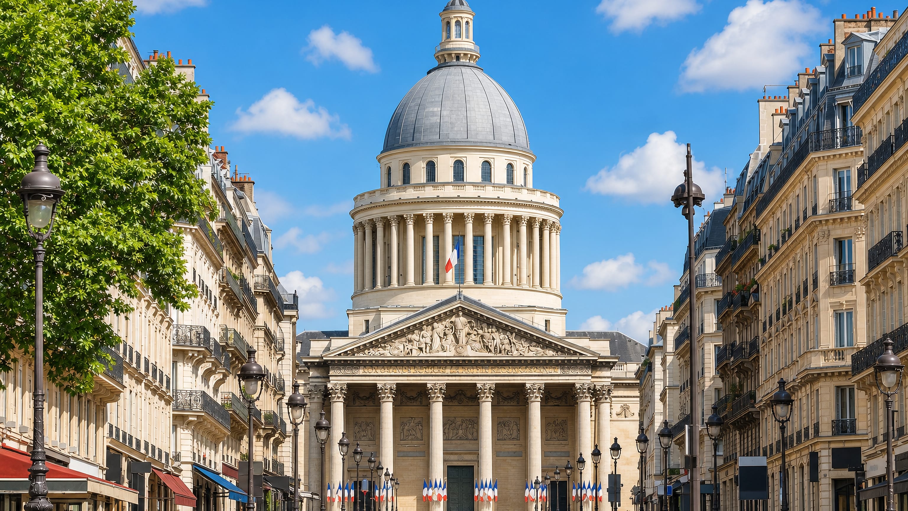 The domed Pantheon at the end of rue Soufflot in the Paris 5th arrondissement, framed by Haussmann facades.