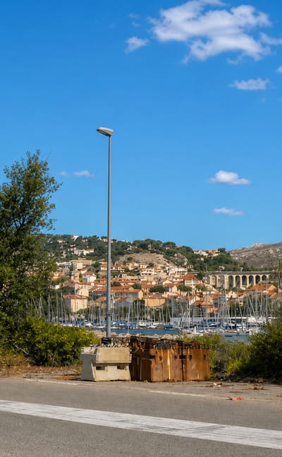 The harbour and railway viaduct of L'Estaque, a fishing district of northern Marseille, seen from a hillside road.