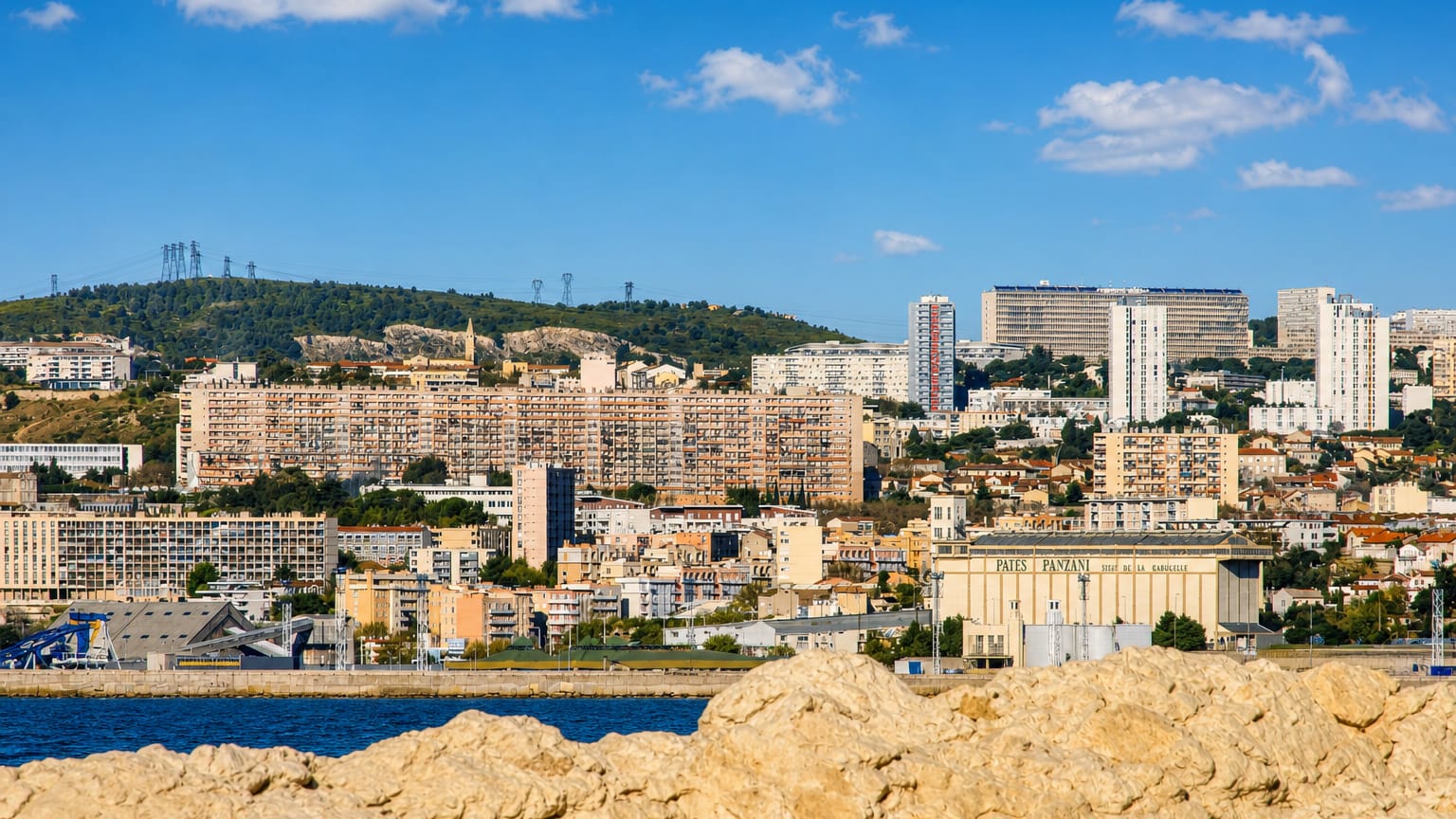 Harbourside view of La Cabucelle, northern Marseille, with the Panzani pasta factory and hillside housing.