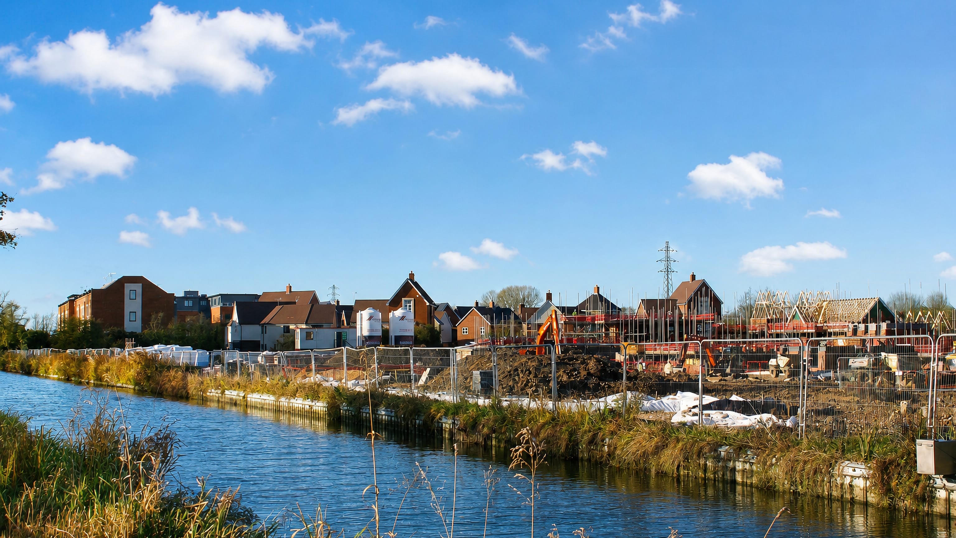 Canal-side new-build houses under construction at Kingsbrook on the eastern edge of Aylesbury.