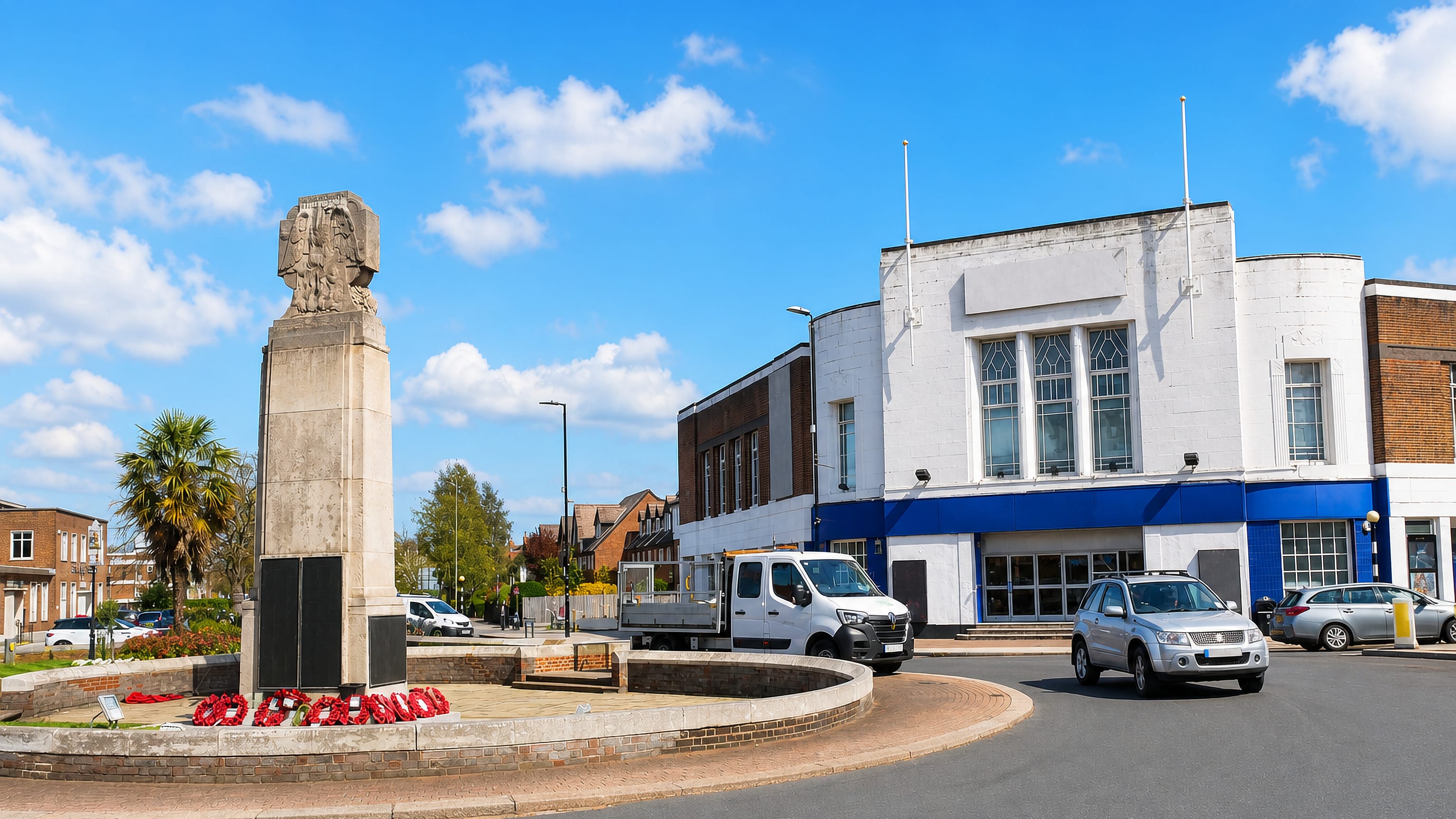 Beckenham's stone war memorial on its roundabout, with the white Art Deco former cinema on the High Street behind.