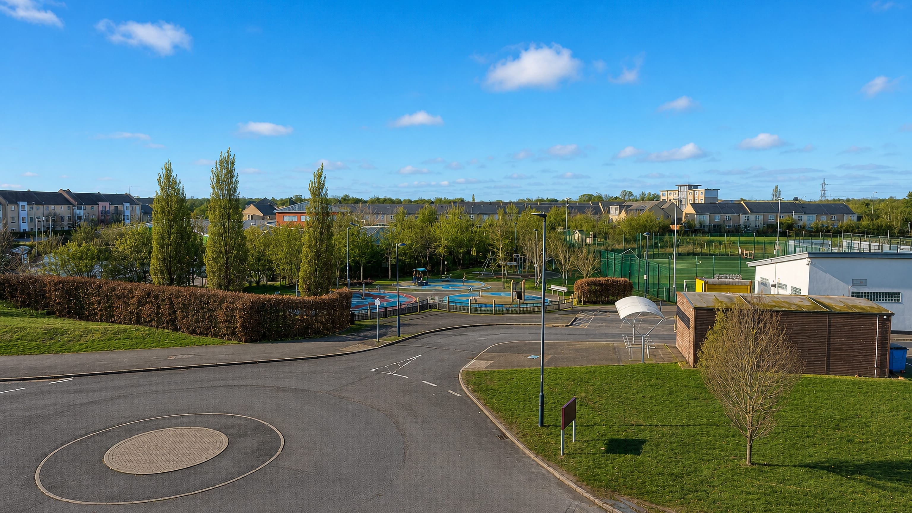 Modern housing, playing fields and a play area at Orchard Park on the northern edge of Cambridge.