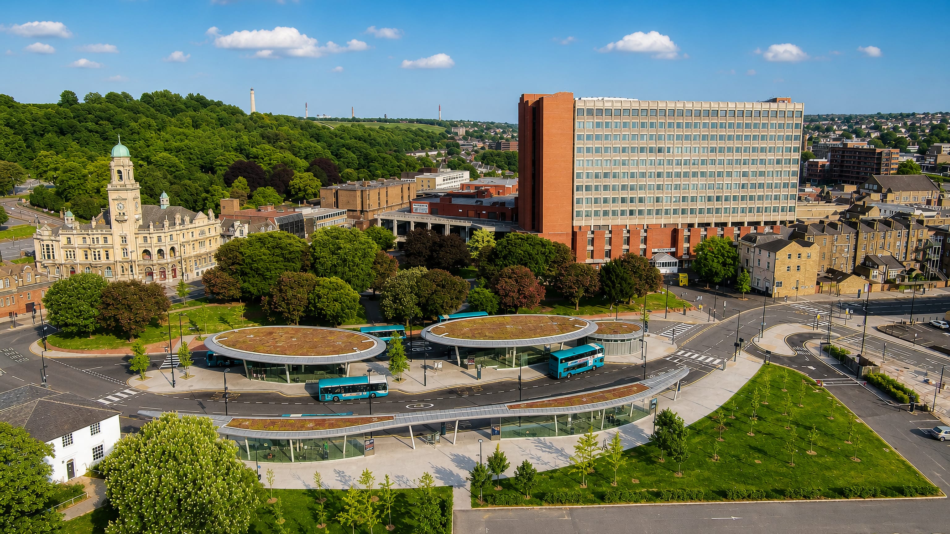 Aerial view over Chatham, England, with its curved-roof bus station, domed old town hall and tower block.