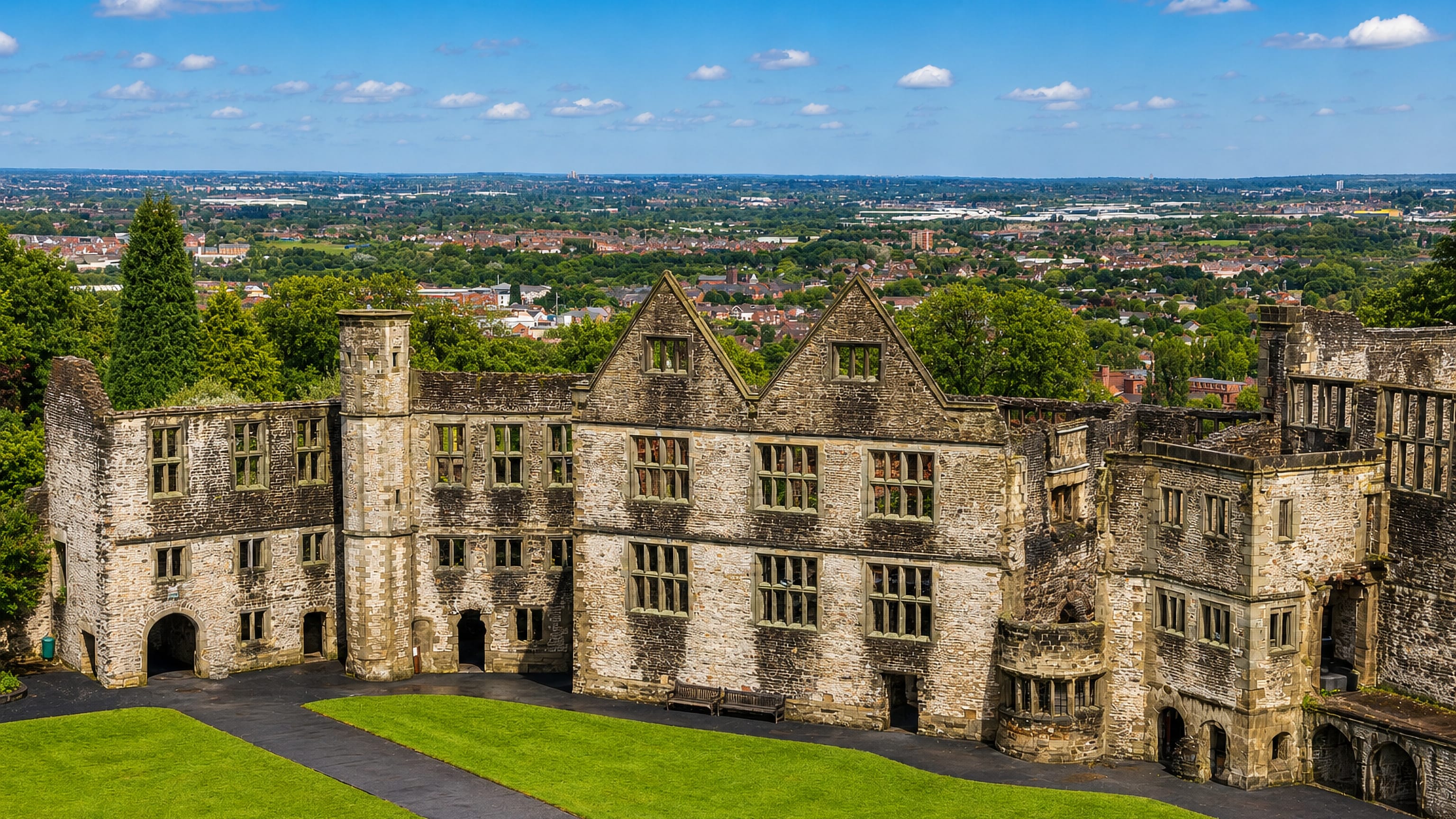 Dudley Castle's ruined stone ranges above the Black Country rooftops stretching to the horizon
