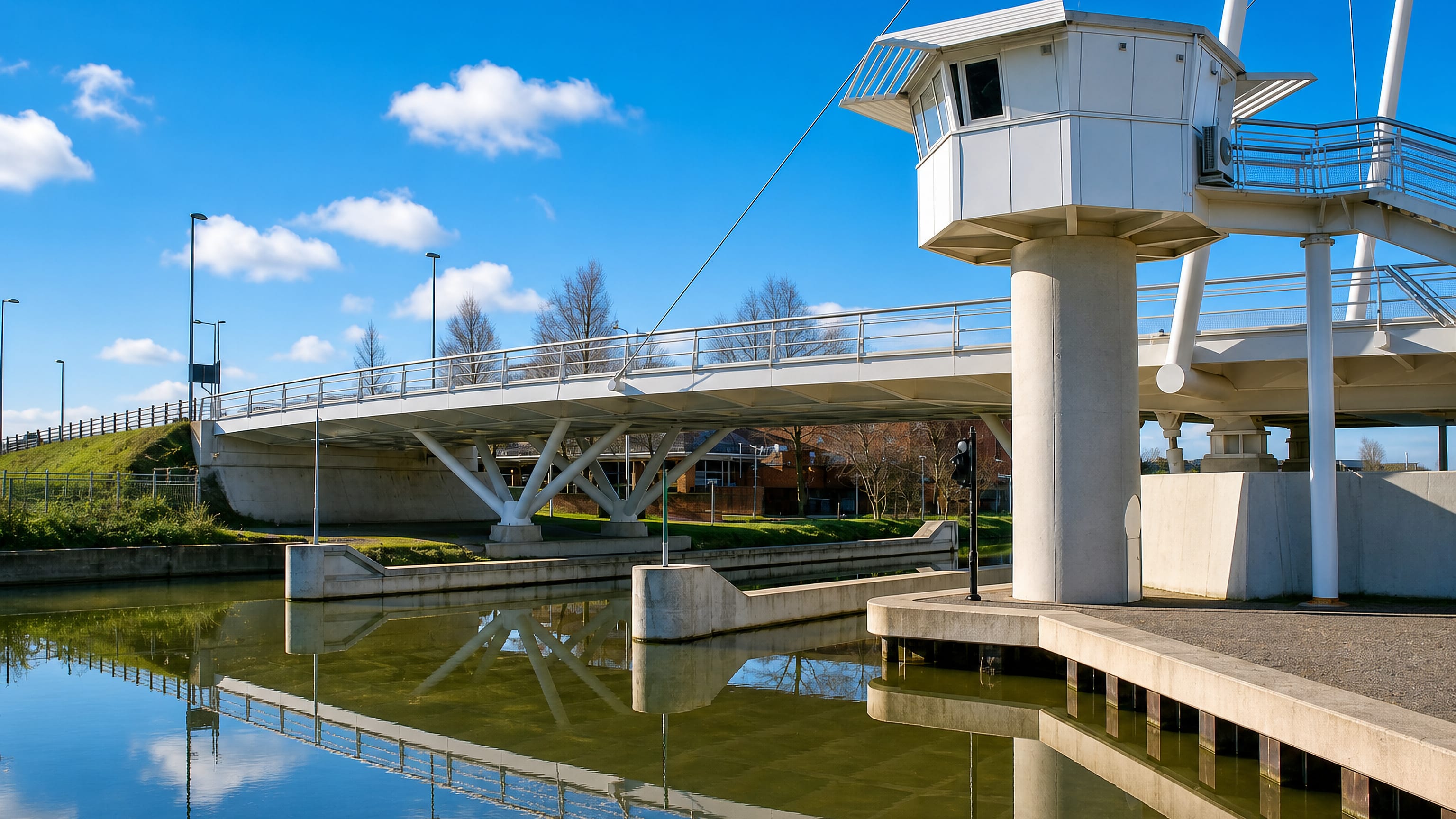 White lifting bridge and its control cabin over the canal at High Orchard, Gloucester Quays.