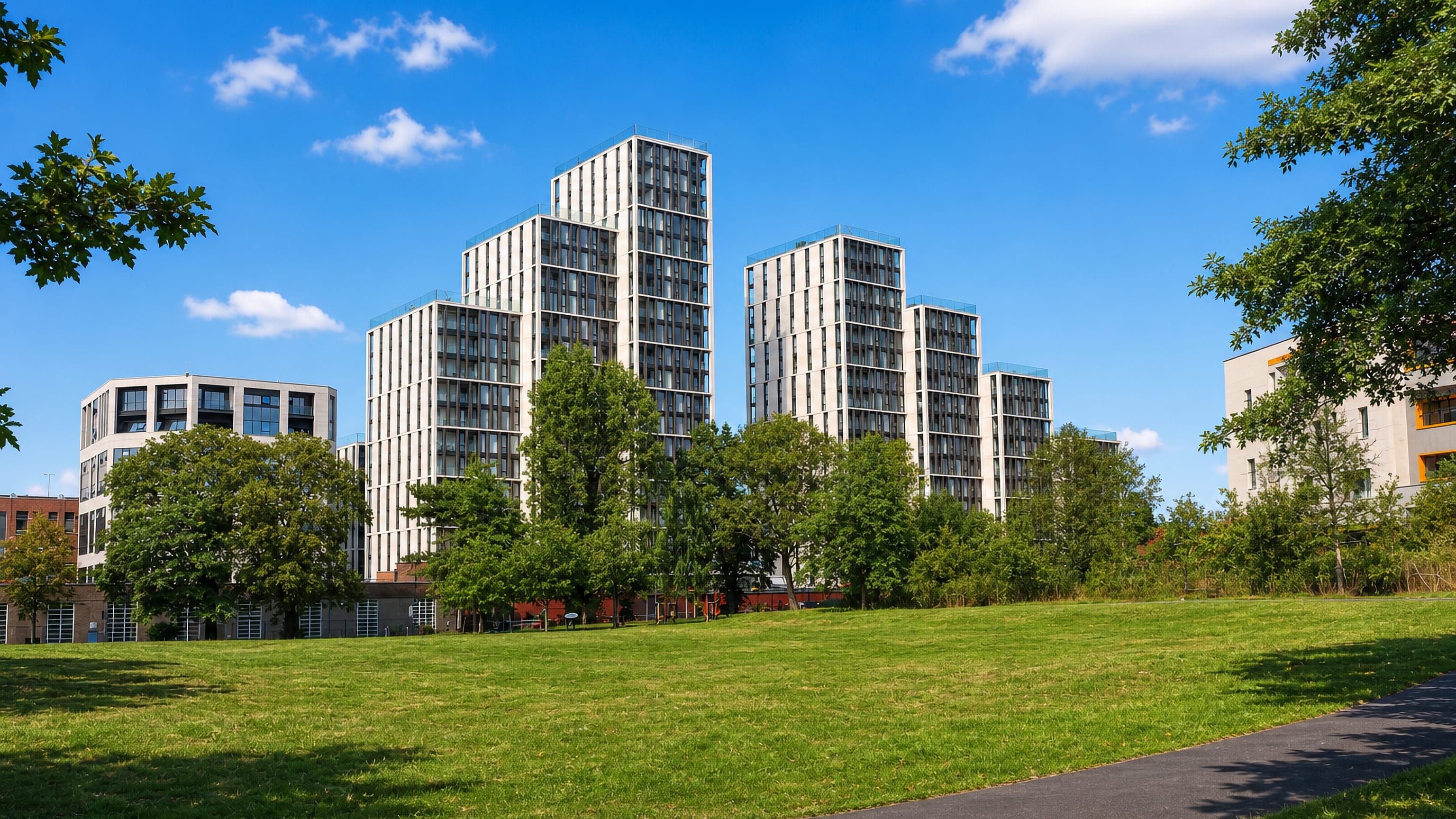 New residential towers rising above a park lawn in Harrow, northwest London.