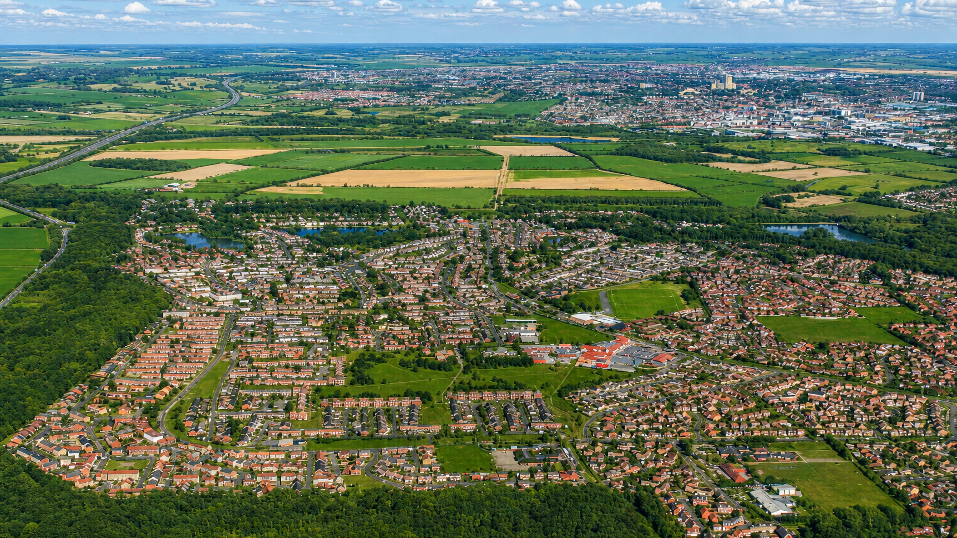 Aerial view over the housing estates and green wedges of Birchwood on Lincoln's western edge.